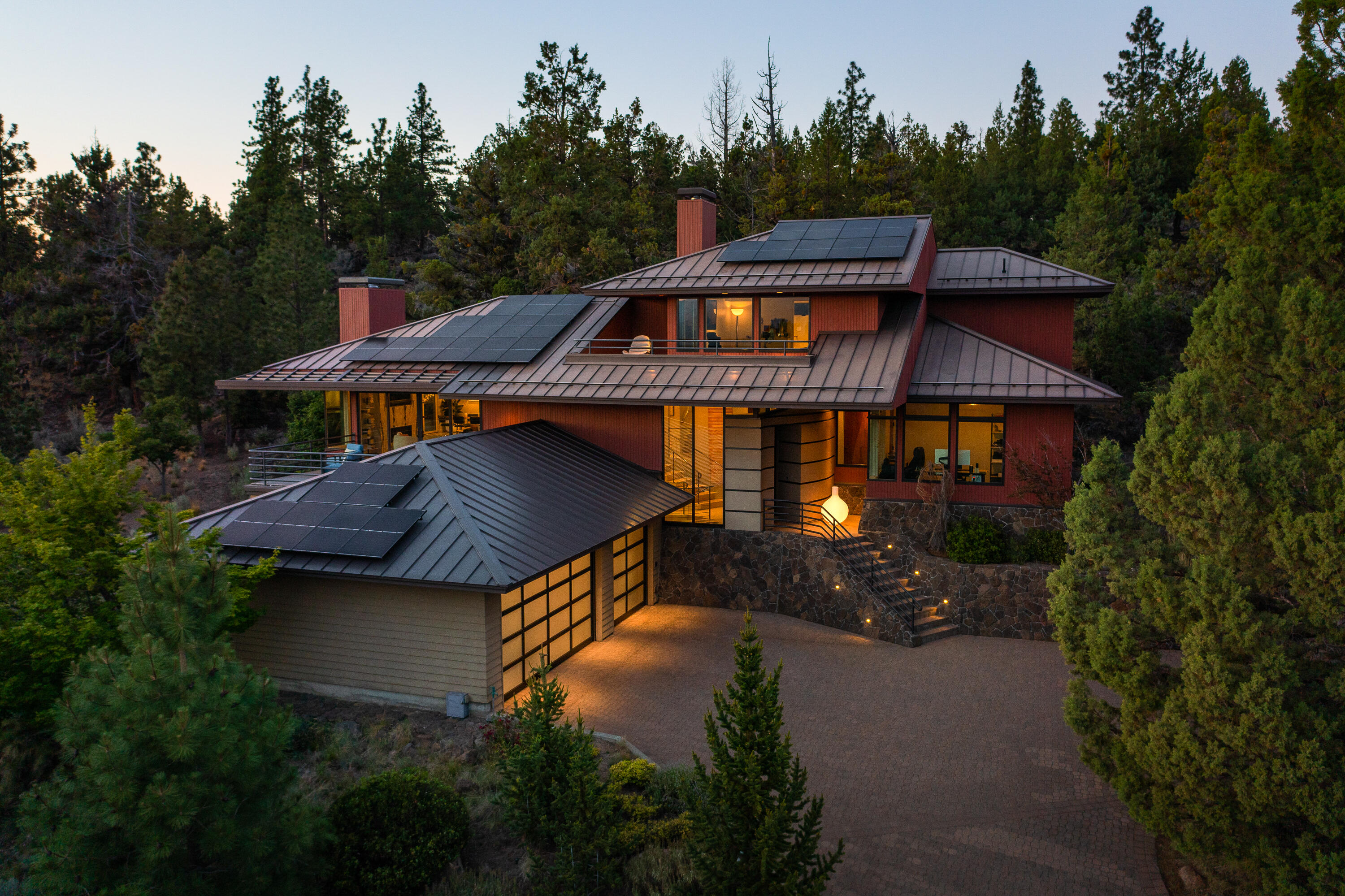 Artfully designed gem high on Awbrey Butte celebrates the Bend lifestyle with panoramic views of the Cascade Mountains. Perfectly private setting nestled into the hillside amongst the boulders of an ancient lava flow offering the best of indoor-outdoor living. Gracious entry welcomes you to an exceptional home styled with sumptuous selections of exotic woods and stone finishes throughout. Open Great Room concept, wholly private Main Suite, large Guest Suites and Den or 4th bedroom. Heated paver driveway and too many tasteful updates to mention.