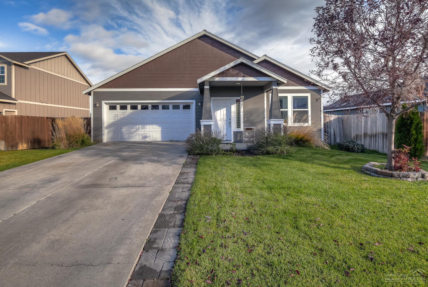 Conveniently located in NW Redmond with easy access to Hwy 20 & Hwy 97. Home features 3bd/2ba, one of which has dbl French doors & makes a great den! Open concept living area w/arched entries, large breakfast bar & fireplace, tiled counters & an over sized pantry. Private Master Suite w/ slider to patio, spacious bath & closet, dbl sinks & linen closet. Forced air plus ductless heat pump to keep you warm plus A/C! Fully fenced w/ auto sprinklers. New exterior paint too - move in ready!
