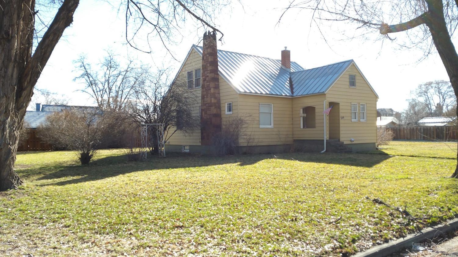 Classic charm in mid-town on .25 acres. Cozy living room has wood burning insert, quaint kitchen with dining area. 2 bedrooms downstairs with adjoining bath. 2nd story has a large bonus room or bedroom. Approx. 800sf unfinished basement. Lots of storage. Plenty of room for RV parking and build a bigger shop/garage. Walk to restaurants, pubs, parks & canyon trail access. This home has been owned by the same family for the last half century and is a rare opportunity to own a piece of Redmond history!