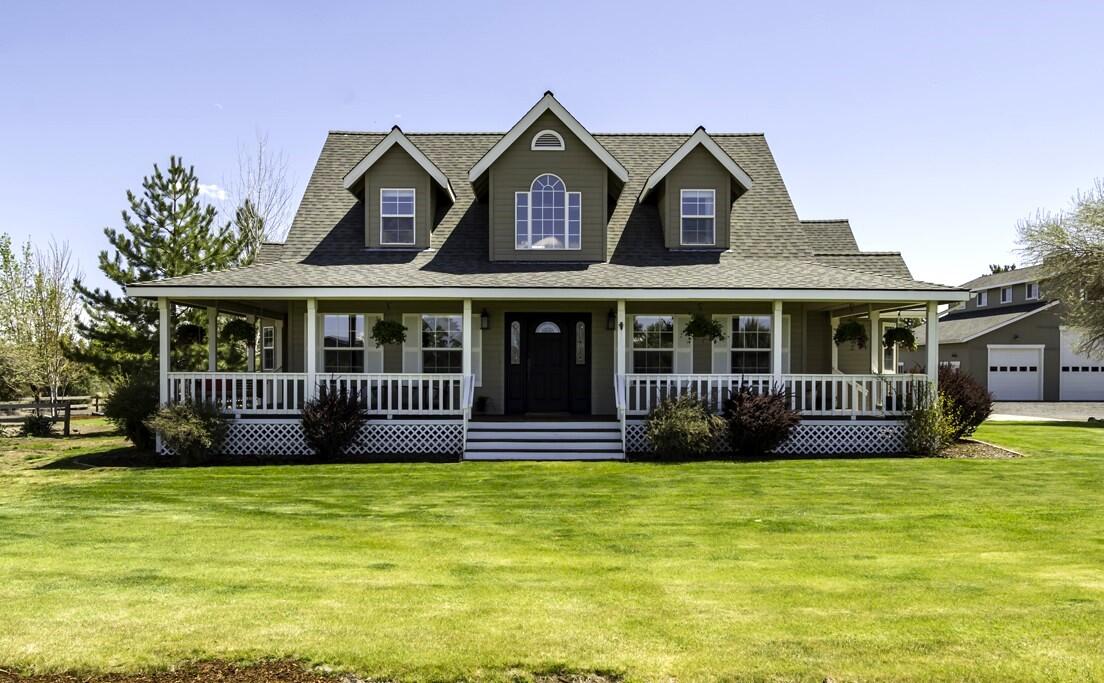 On the east side of Bend, Oregon, this home offers an unparalleled opportunity to embrace living amidst nature's splendors. The home is on 4.77 acres of land and enjoys breathtaking views of the Cascade Mountains and desert landscape. Inside, you will find 4 bedrooms, the primary and office on the main level. One downstairs bathroom has been updated. The home also has a new HVAC system. Outside, the property unfolds into an oasis of relaxation and recreation. A wraparound deck offers the perfect setting for sunsets; the back deck offers room for alfresco dining. This remarkable property features a large 3 bay shop with a bonus room above, inside and outside RV parking space, shop and storage areas, and a guest suite, providing versatile spaces for hobbies, storage, or guest accommodations. Conveniently located just minutes from downtown Bend, this exceptional property offers easy access to many amenities, dining, shopping, and outdoor recreation opportunities.