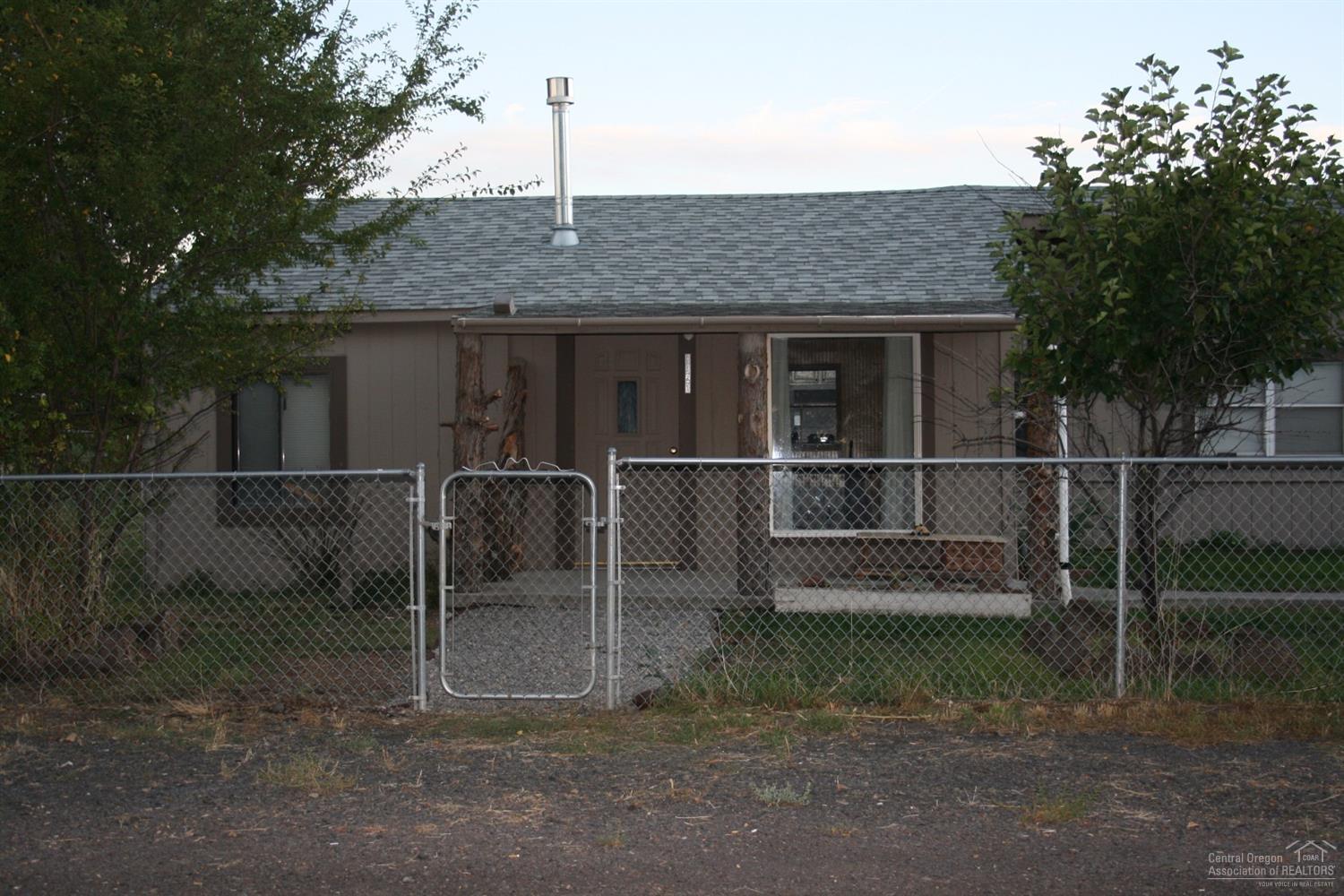 Lots of potential with this piece of property! With 3 beds, 2 baths sitting on over half an acre, the possibilities are endless. Plenty of room for parking all your toys, RV parking and storage. Well, city sewer and gas heat.