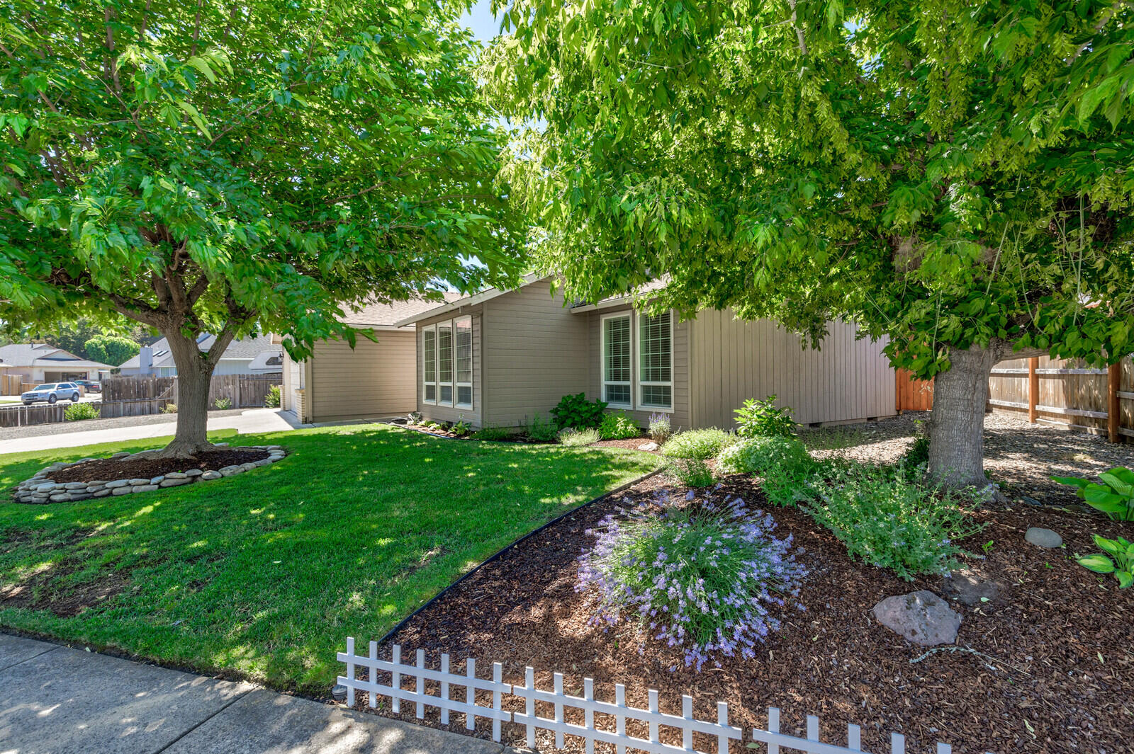 This beautiful home in East Medford is move in ready with fresh interior paint, hardwood floors, granite counter tops, new blinds, new oven and new microwave. The outside also has fresh paint, oversized RV parking with a sewer dump and upgraded electrical. Finished epoxy garage w/ a finished attic. Large newly painted covered patio for entertaining in the private backyard. Come see!