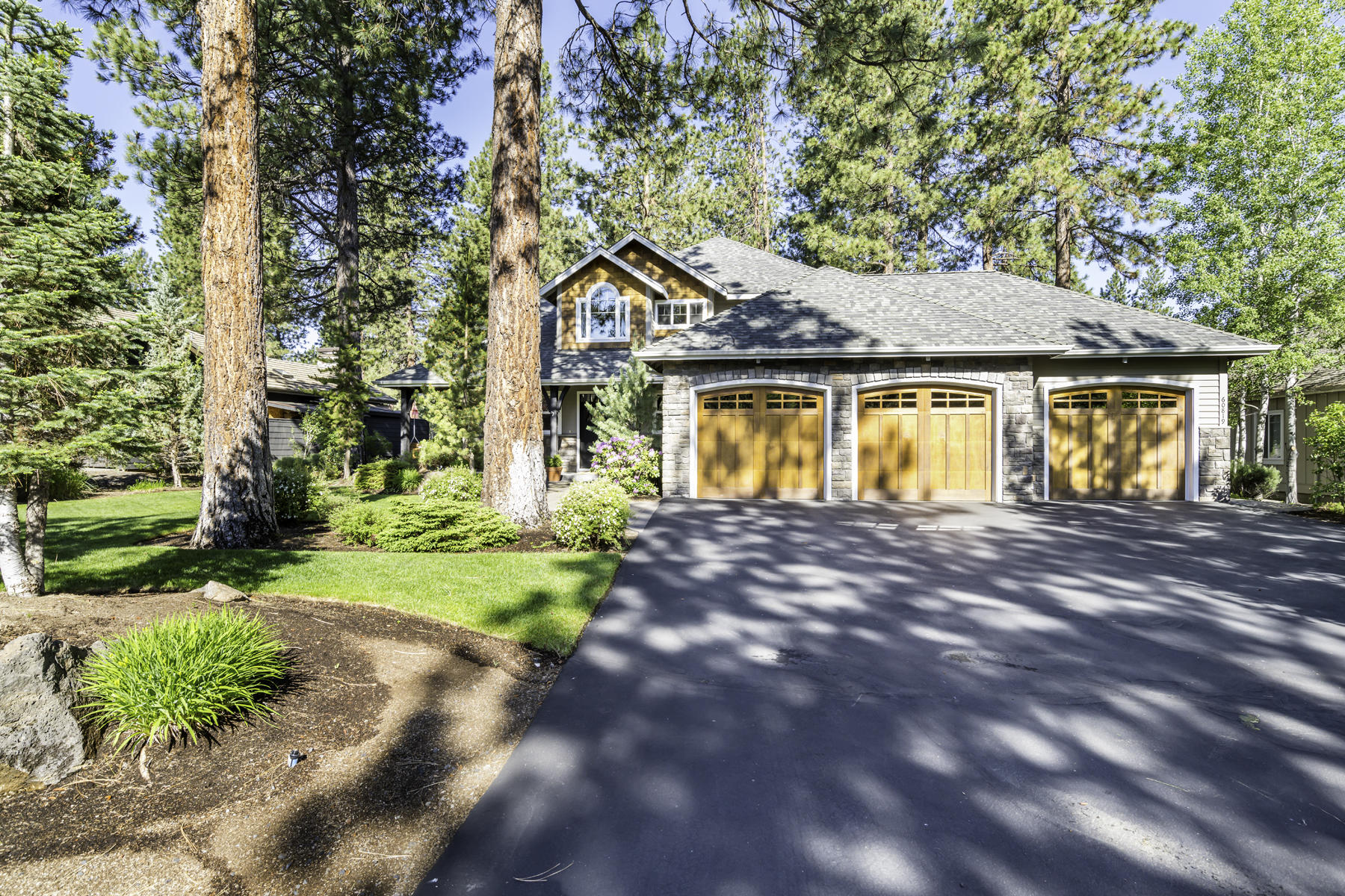 Experience picturesque views of the 3rd fairway in this stunning, custom-built home in Widgi Creek. Your backyard oasis includes a paver patio, extensive Trex Decking, private hot tub area, and a water feature. In the main living area, you will find floor-to-ceiling windows allowing in an abundance of natural light, a dramatic stone fireplace, and vaulted ceilings.  Kitchen highlights include large center island, 2 ovens, coffee nook, and a large pantry. The main level master has private access to the outdoor hot tub. Master bath includes a floor-to-ceiling tiled shower and a large soaking tub. Upstairs are 2 large bedrooms, one full bath, and a large bonus/family room with a separate office space. Ideal for someone working from home or the perfect homework station for the kids.  Large 3 car garage, w plenty of additional space for tools, bikes, golf gear, & toys.  Great location with golf & pickleball out your front door, along with easy access to Bachelor & the Cascade Lakes.