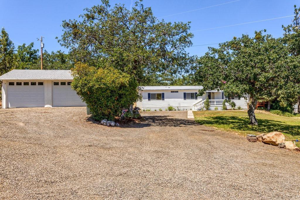 Beautifully remodeled home on 5 beautiful acres with amazing views. Remarkable light & bright home features an open floor plan with 2 bedrooms, 2 bathrooms, huge living room, spacious dining room w/built-in hutch, large bonus room and extra spacious room that can be used as an office. Wonderful kitchen with abundant cabinetry, all new appliances and great counter top space. Large laundry area. Updates include all new paint, new laminate flooring, new carpet, new fixtures, one new deck & a sweet huge deck that overlooks the views and property. Detached 2 car garage with new garage doors, RV parking & tons of parking area, fencing, fruit trees, new gravel. Gorgeous mountain views. Move-in ready.