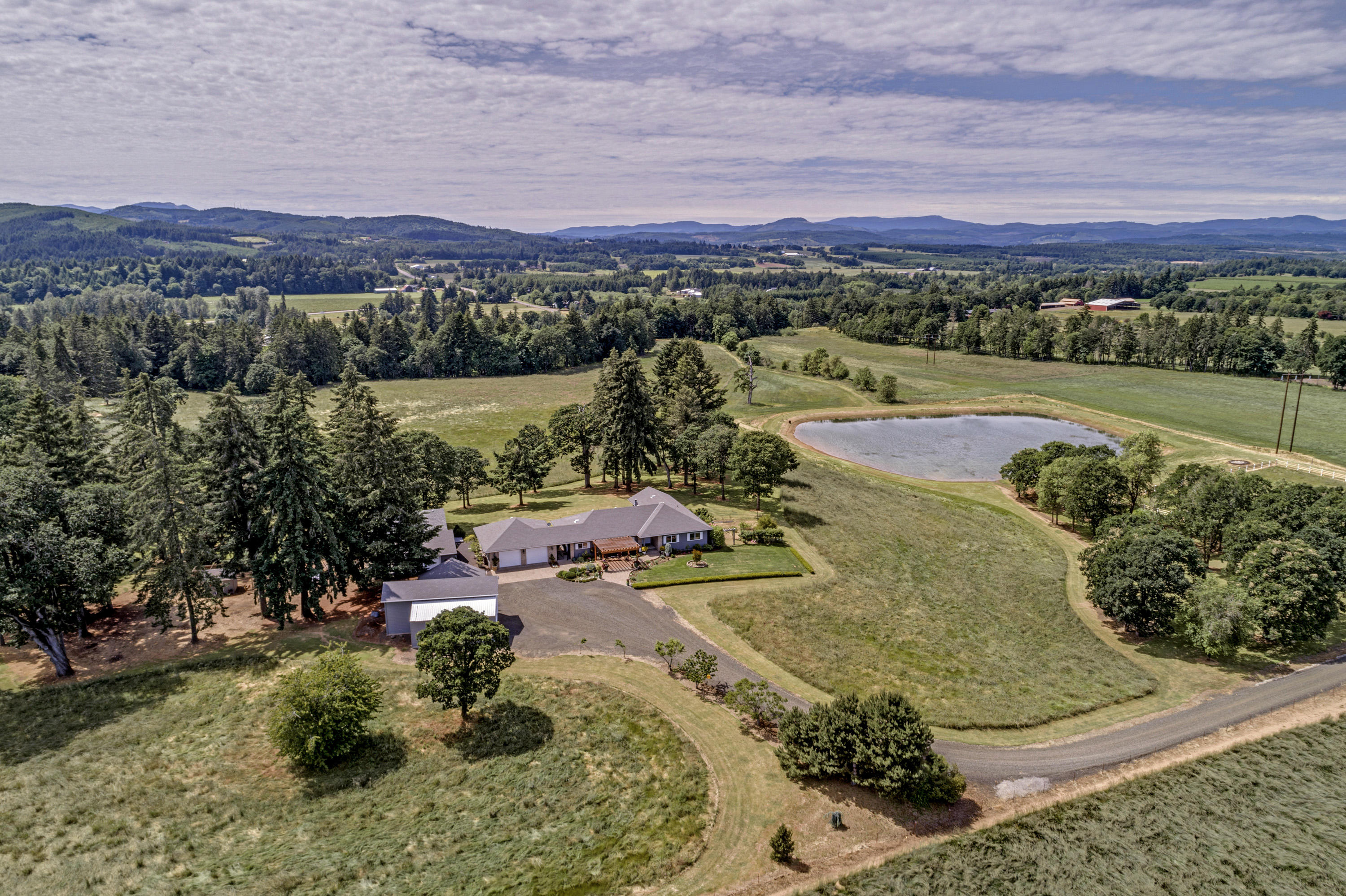 Private pristine property on over 74 acres in beautiful farmland abuts Mill Creek. 2791sf home 3
bedroom & 3 bath with gorgeous office. Owners Suite features wall of windows and 2 spectacular custom walk-in closets. Oversized 2 car garage with workshop and wine room. The 1760 Auxiliary studio features full bathroom, sauna, FS hot tub and full gym. Garage for RV, boat, cars and toys. Poultry coop. 60x70 Barn, 2 stall horse barn and tack room, pasture fenced and cross fenced, Seasonal Pond.