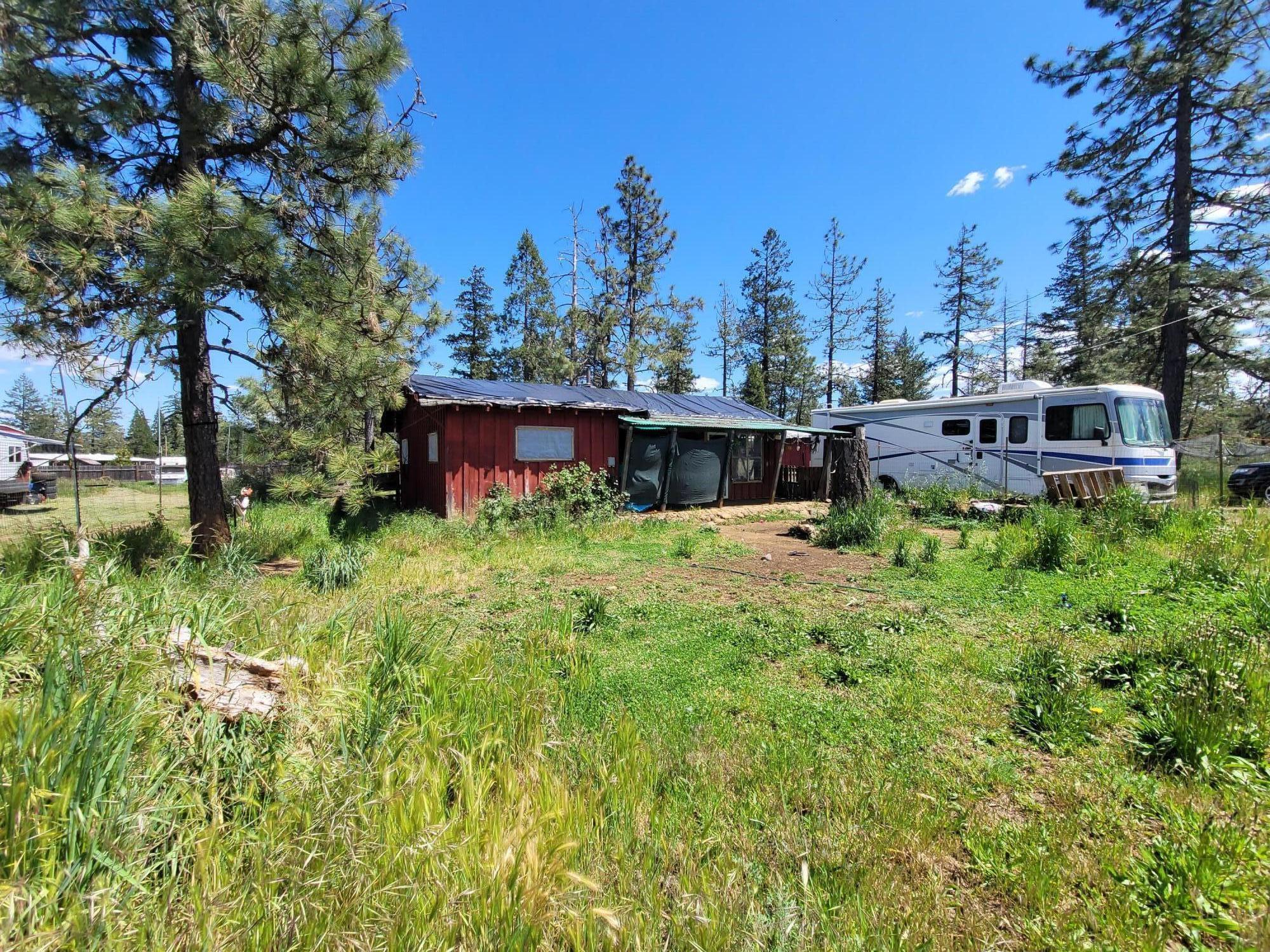 INVESTORS SPECIAL!!! 2 bedroom, 1 bath home with attached garage on 1 flat, usable acre! A great opportunity at a great price! Although home is occupied value is in the land. Strong well. Collapsed septic is not functioning. Property is right across the street from the airport and walking distance to the river. Seller will not perform any repairs or upgrades. The seller will not remove any items off the premisis and the current tenant will come with the property. This home/property being sold AS IS.