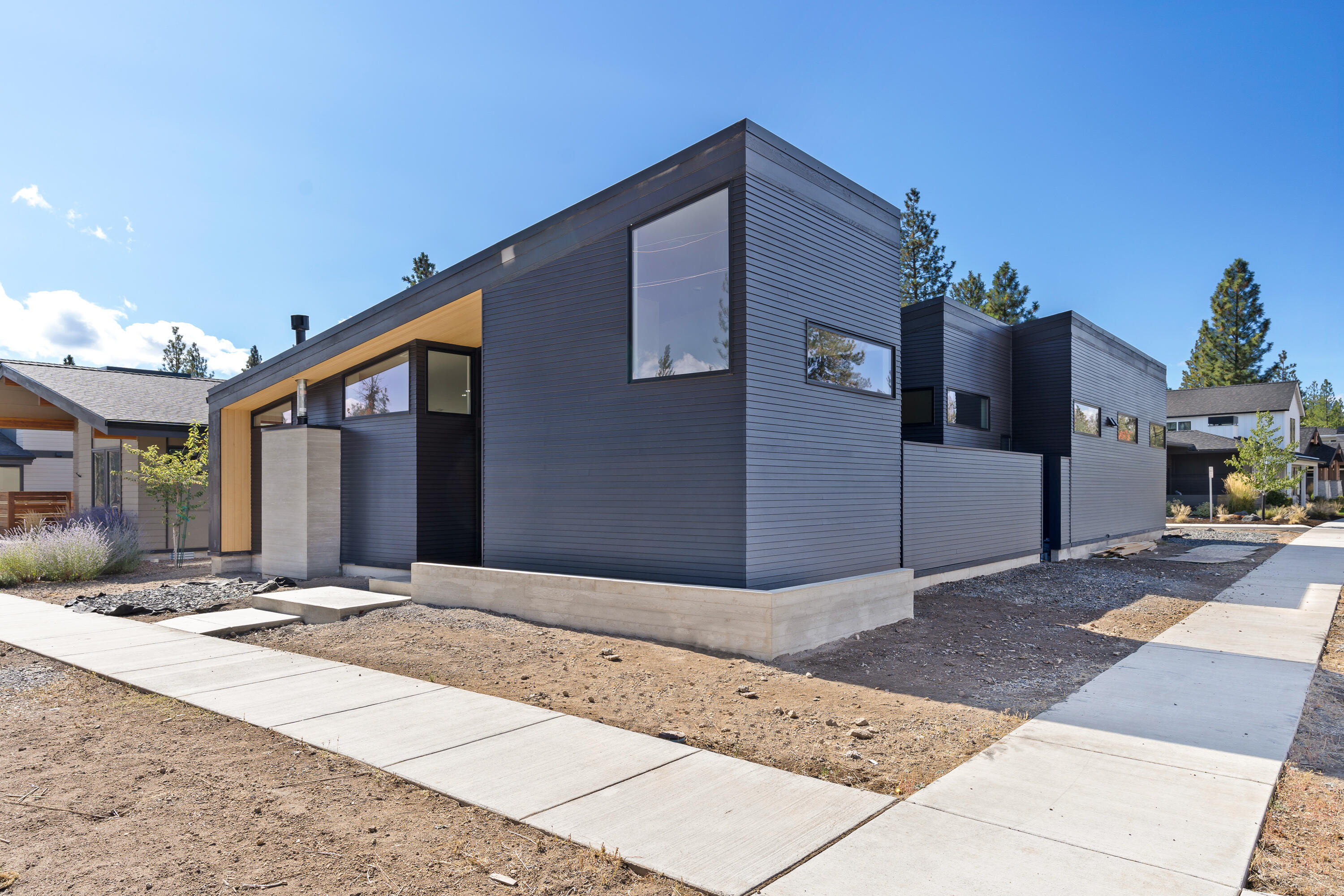 Welcome to this stunning Scandinavian designed, custom single level home located in the highly sought-after Discovery West neighborhood on Bend's West side. Enter the home and be greeted by a sun-filled interior, wide open great room flowing into the chef's kitchen, and outfitted with a designated office. Further amenities include built-in refrigerator and freezer, hardwoods, tile bathrooms, vaulted ceilings, and plenty of natural light. The oversize 2 car garage is prewired for electric vehicle charger and features a heated 8x14 plumbed for a sink, perfect for an art studio or workout room. To the exterior of this home, you will appreciate its incredible private setting, showcased by a designated green belt across the street, low maintenance landscaping, very private courtyard with natural gas and a concrete fire pit. Don't miss the opportunity to own this incredible home; you've found the perfect combination of accessibility and luxury.