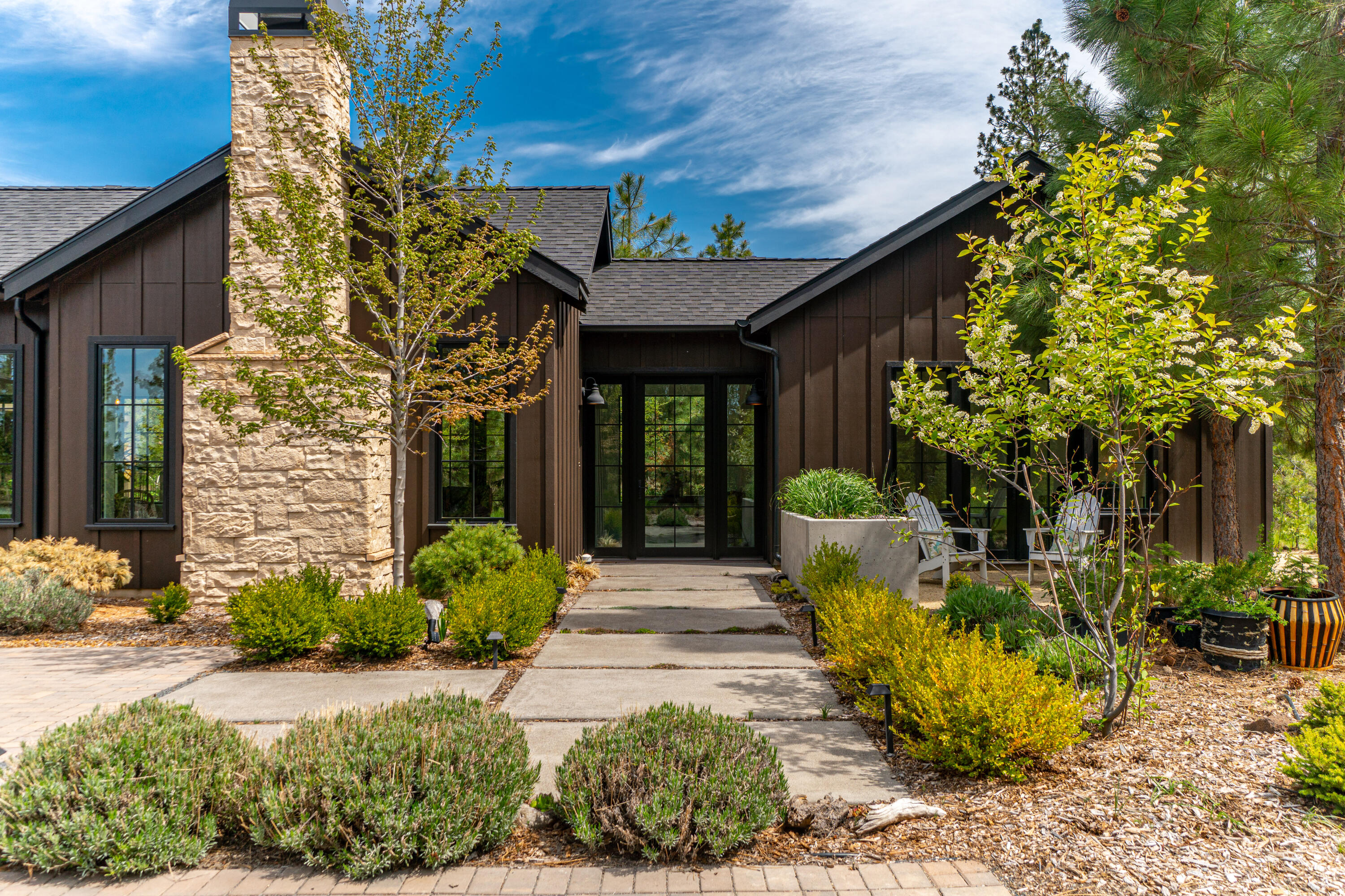 Located in a highly desirable area on an ultra private .96 acre lot. Close to hiking, biking, camping, river trails, Mt Bachelor, & lakes. Minutes from the Deschutes National Forest makes recreating easy while still being close to the conveniences of Bend's Westside. This home offers an open air old world charm mixed w/new innovations like radiant floors & tankless on demand hot water. Each en suite bedroom is complete w/walk in closets & full baths. Indoor/outdoor living at its best from every room through French doors. The carefully planned landscaping & home placement creates a private hilltop oasis with a mix of plants, mature trees, natural rock outcroppings plus an abundance of wildlife. A gardener's delight including a custom built greenhouse w/water & raised beds plus an outdoor garden area & a whole property smart sprinkler system. Extra deep 984 Sq Ft 3 car garage w/10 ft tall doors plus 360 Sq Ft of attic storage. Every day feels like a vacation in this custom built home.