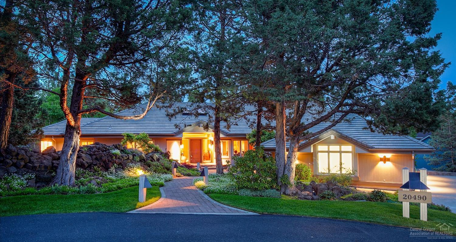 Spectacular single level in gated Mountain High. Home sits on a private .52 acre lot surrounded by lush greenery. Paver walkway winds through beautiful native landscaping and huge lava rock water feature with pond. When you enter you will love the vaulted great room with western hemlock ceilings, extra large windows, formal dining and spacious gourmet kitchen with subzero and dacor appliances. Home has many updated features, plus 1000sf garage with storage galore! Amenities list available upon request.