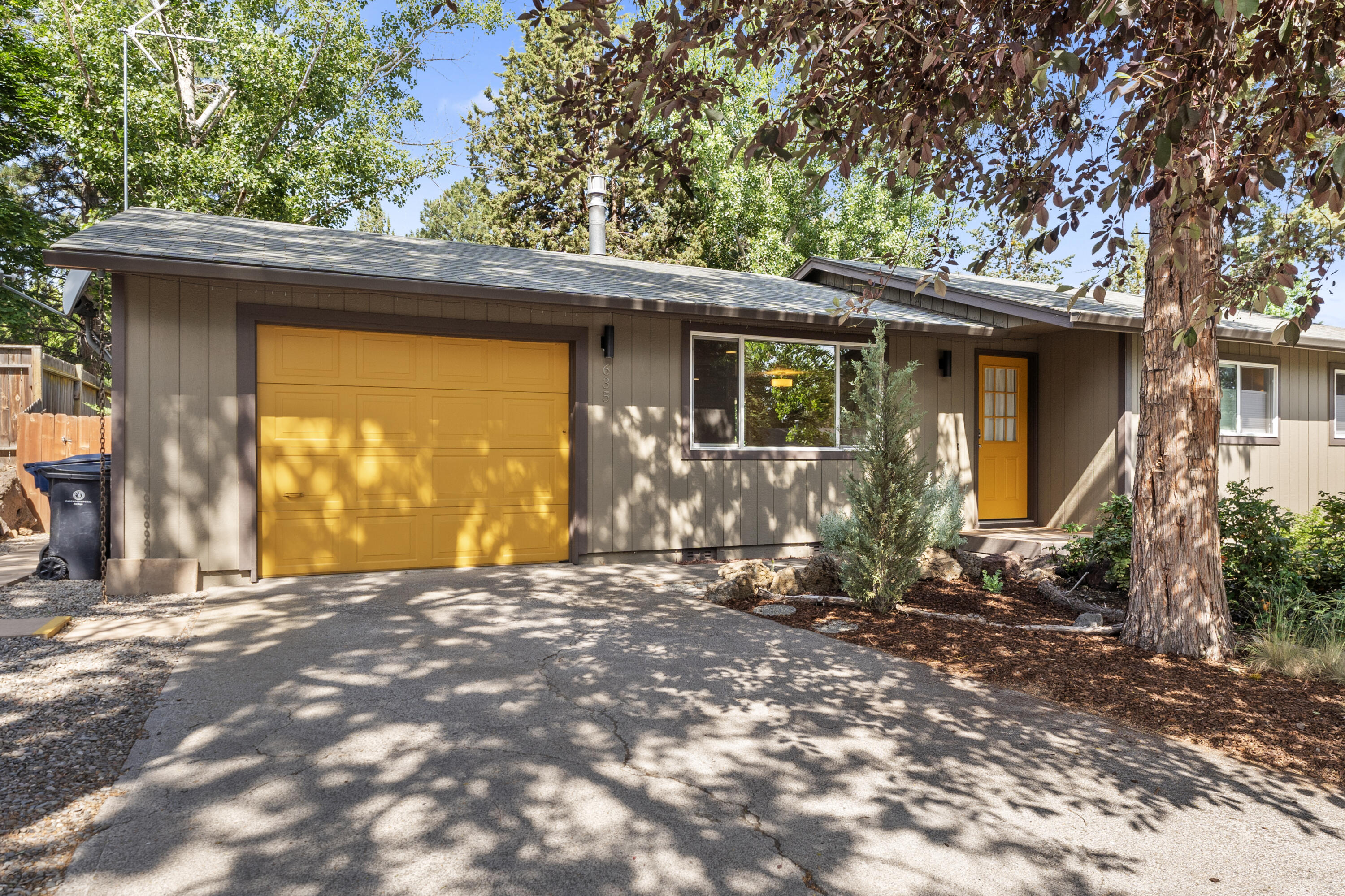Live the Bend lifestyle in this thoughtfully updated 3 bed, 1 bath home just minutes from Vince Genna Stadium, the Old Mill District, and all the restaurants, trails, and shops of downtown. Step inside to brand-new hardwood floors, stylish updates, and a cozy layout that feels instantly like home. The 6,970 sq ft lot offers plenty of room to build an ADU, making it a great investment for the future. Outside, enjoy low-maintenance, water-wise landscaping and a lush pollinator garden perfect for relaxing mornings or evening hangs under the stars. The property currently holds a short-term rental permit (non-renewable due to recent city code changes), adding even more versatility for the right buyer. Whether you're looking for a full-time home, weekend retreat, or future expansion, this one has it all. Seller may even consider selling it furnished—just bring your bags and start living your Bend dream!