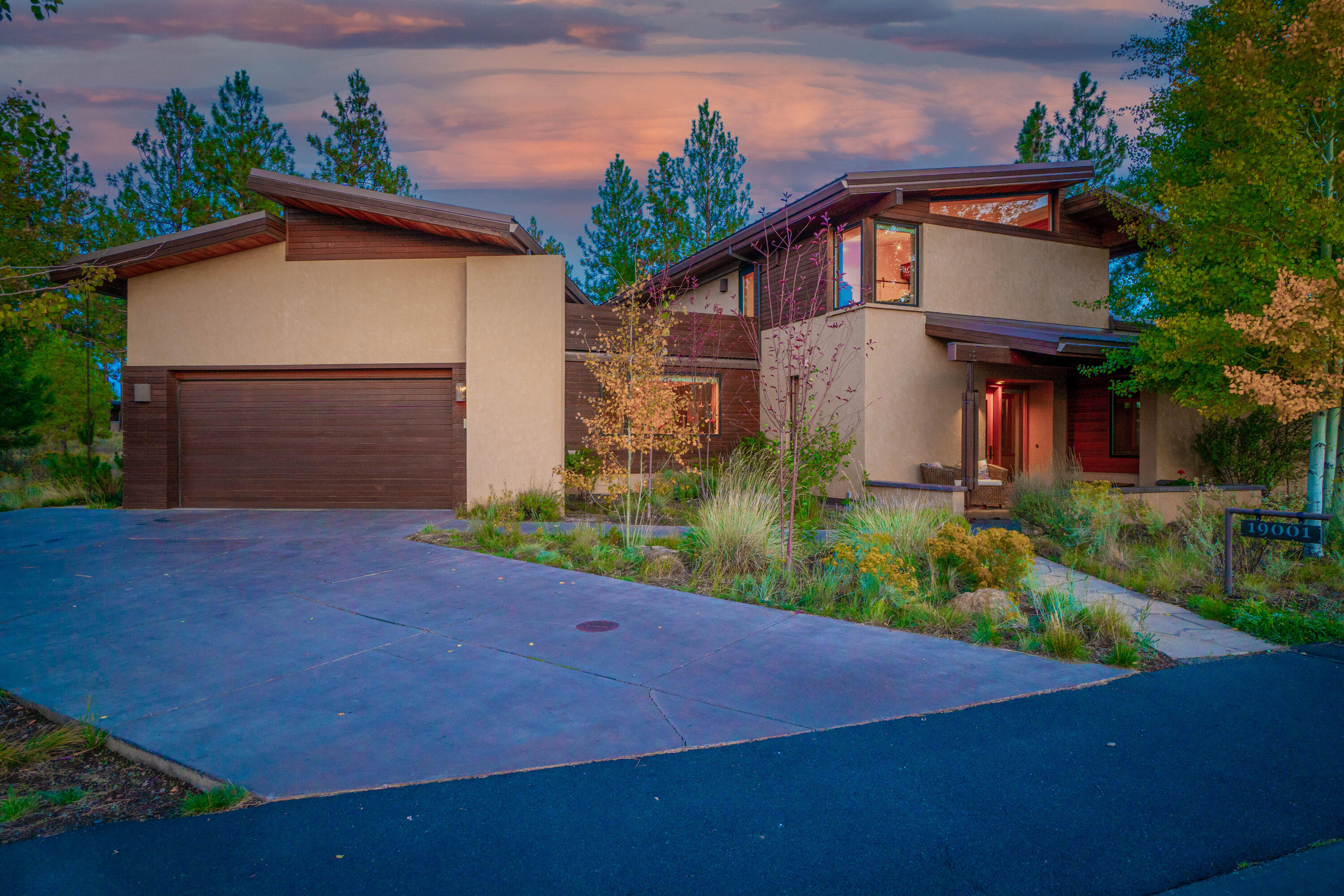 This beautiful and sophisticated home effortlessly blends concrete, steel, and reclaimed wood to provide a contemporary, clean and transitional feel in one of the most natural and pristine neighborhoods in Bend's Westside. Built with a focus on energy efficiency, the home has 12 in. thick Rastra block walls and structural integrated panels, radiant concrete floors with stone insets, and high efficiency mini splits throughout. The home blends with nature with a bright southern exposure, an enormous wall of windows, a secluded courtyard, a screened patio overlooking HOA space, and peak-a-boo views from the house and rooftop deck. The indoors are defined by distinctiveness and flexibility with space for work, sleep, guests, and play in the home, basement and flex space above the garage. Come experience Shevlin Commons at its best and make this gorgeous home your launchpad for your next adventure.