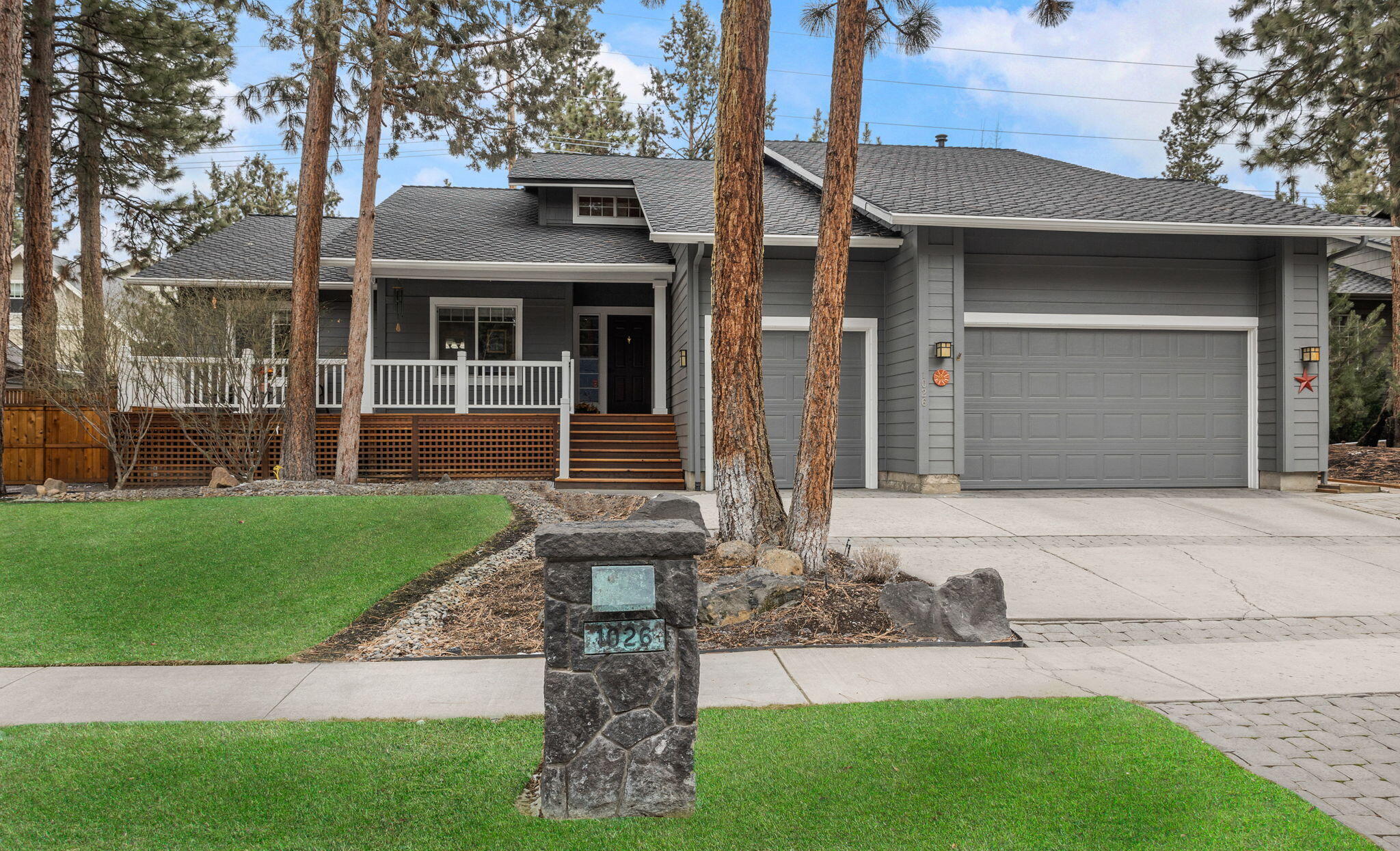 Lovely one owner, single level on a large lot in NW Bend's beloved Newport Hills, just a few doors from Sunset Park on a quiet, no through-traffic street. True triple car garage offers extra room for toys. Lots of light & vaulted ceilings make a comfortable flow with generous spaces for entertaining. Large open kitchen/gathering room with eating area, terrific cabinetry storage & huge island, gas fireplace that generates cozy heat & exterior deck access. Adjacent living room with view to decking & extensively landscaped & fenced backyard. Beautifully maintained & substantially upgraded features, finishes & systems including hardwood flooring throughout, quartz & granite tiled counters, appliances, tiled baths, interior/exterior paint, furnace with recirc hot water, A/C & 50 year roof just to name a few. Great location near the Galveston corridor, NWX, Newport Avenue, Westside schools, Shevlin Park & paved pathway to Phil's trail. Stellar location & better than new, don't miss this one!