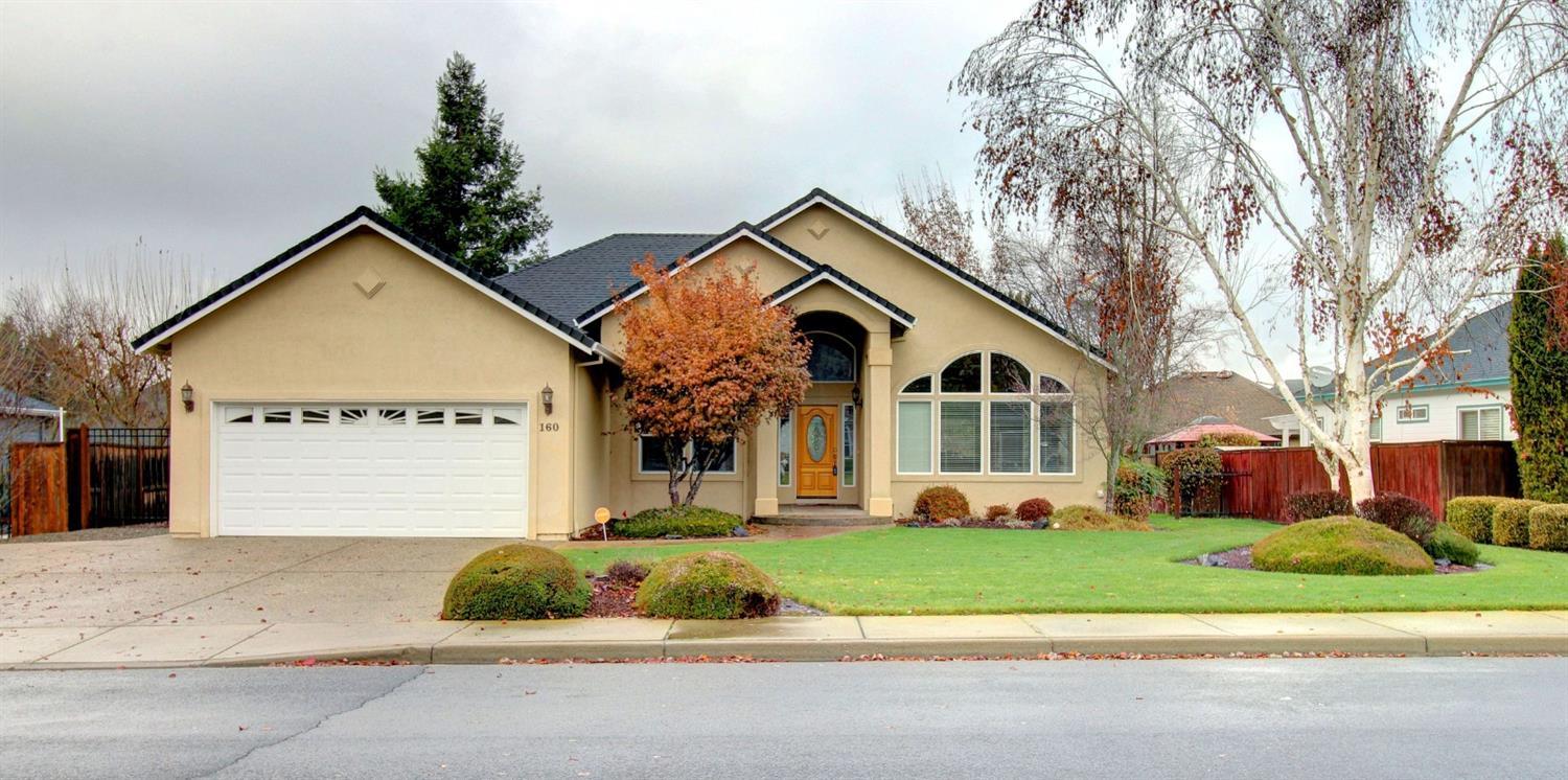 This immaculate single level home in the friendly Eagle Point Golf Community features an open floor concept of 1636 easy-maintenance sq ft, 3 bedrooms, 2 bathrooms offers marble entry way, hardwood floors in the kitchen, large windows, soaring ceilings and skylights illuminate natural light throughout. Large living room, spacious kitchen has granite counters. Master suite features a ceiling fan, coffered ceilings, bathroom with granite counter tops and dual sinks, linen cabinets and extra large walk-in closet. The front bedroom with arch topped window makes a perfect den. Privacy fenced backyard with paved patio, professionally maintained landscape yard and automatic sprinkler system. Finished 2 car garage. Enjoy the community waking paths and surrounding mountain views. This home shows pride of ownership and is clean as a whistle ready to move right in.