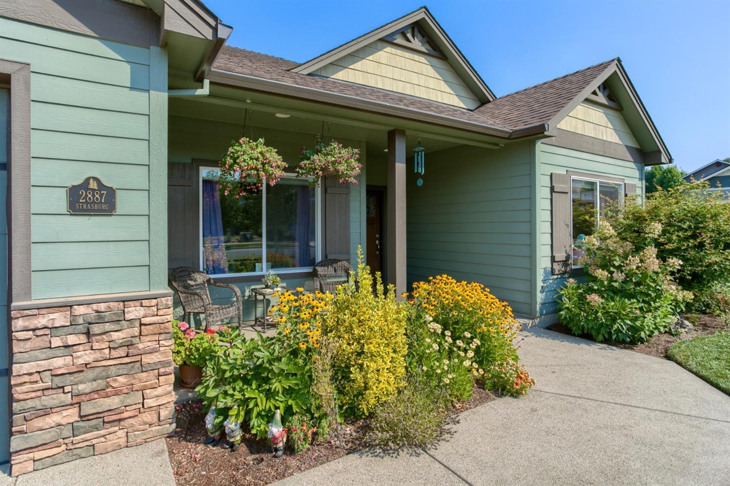 This wonderful 3 bedroom 2 bath 1,621 square foot home sits in a very desirable neighborhood in East Medford. Perfectly maintained inside and out, this home features stunning engineered hardwood flooring, granite counters, gas range, stainless appliances, gas fireplace in the living room, plenty of nice dark cabinets, Large master bedroom with walk in closet, ceiling fan and amazing master bath with jetted tub, separate shower and double sinks. Outside there is a huge back yard with a covered patio, a large deck, and a beautiful lawn. Fantastic landscaping and mature trees are the finishing touches that provide enjoyment and privacy. This one has it all.