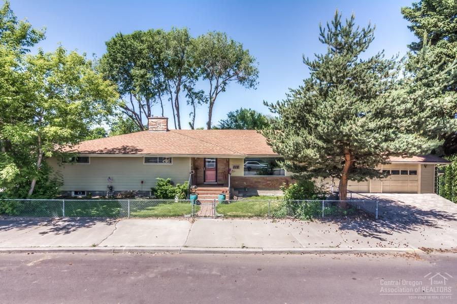 Elegant home with yesterday's charm located in downtown core. 3 bedrooms & 2 baths on the main level along with an updated kitchen, picture window into the living room & a centrally located fireplace are just a part of the charm of this home. Downstairs includes a large bonus room with another fabulous fireplace, set-up for a wet bar, possible 4th bedroom, full bath, laundry area, storage & furnace room. Enjoy the private backyard from the covered back porch or spend some time in the sunshine, gardening in the side yard of this oversized, city lot!