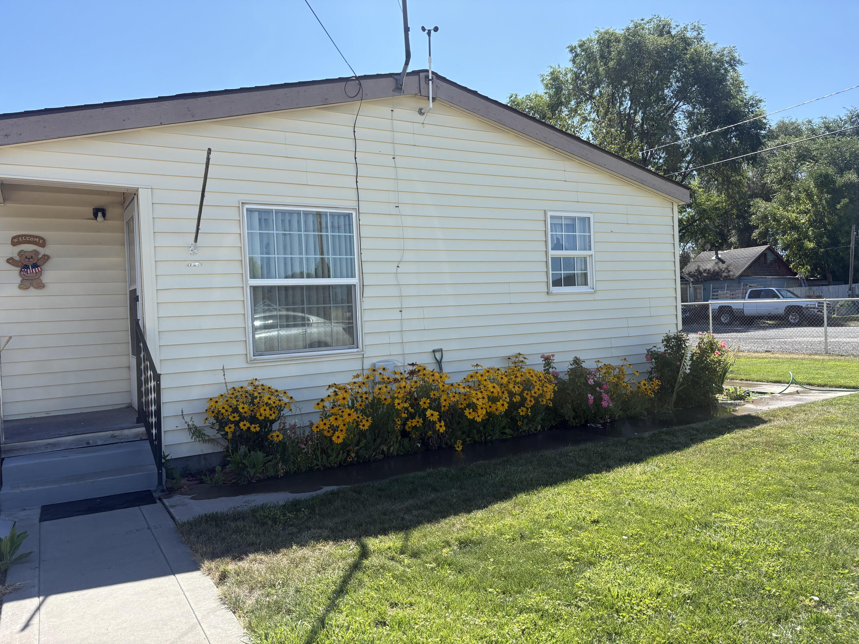 Looking for a home in Merrill ?
3 bedroom 2 bath manufactured home on a full foundation with tie downs. Very well kept with the following updates: laminate flooring, new master bath with walk in shower, lots of added storage in the home.
Great open floor plan large kitchen and dining room. Attached garage with added laundry room and shop area. This property also has a single car garage.
Covered patio, completely fenced yard and landscaped.
Lots of extra parking on the lot that is graveled.