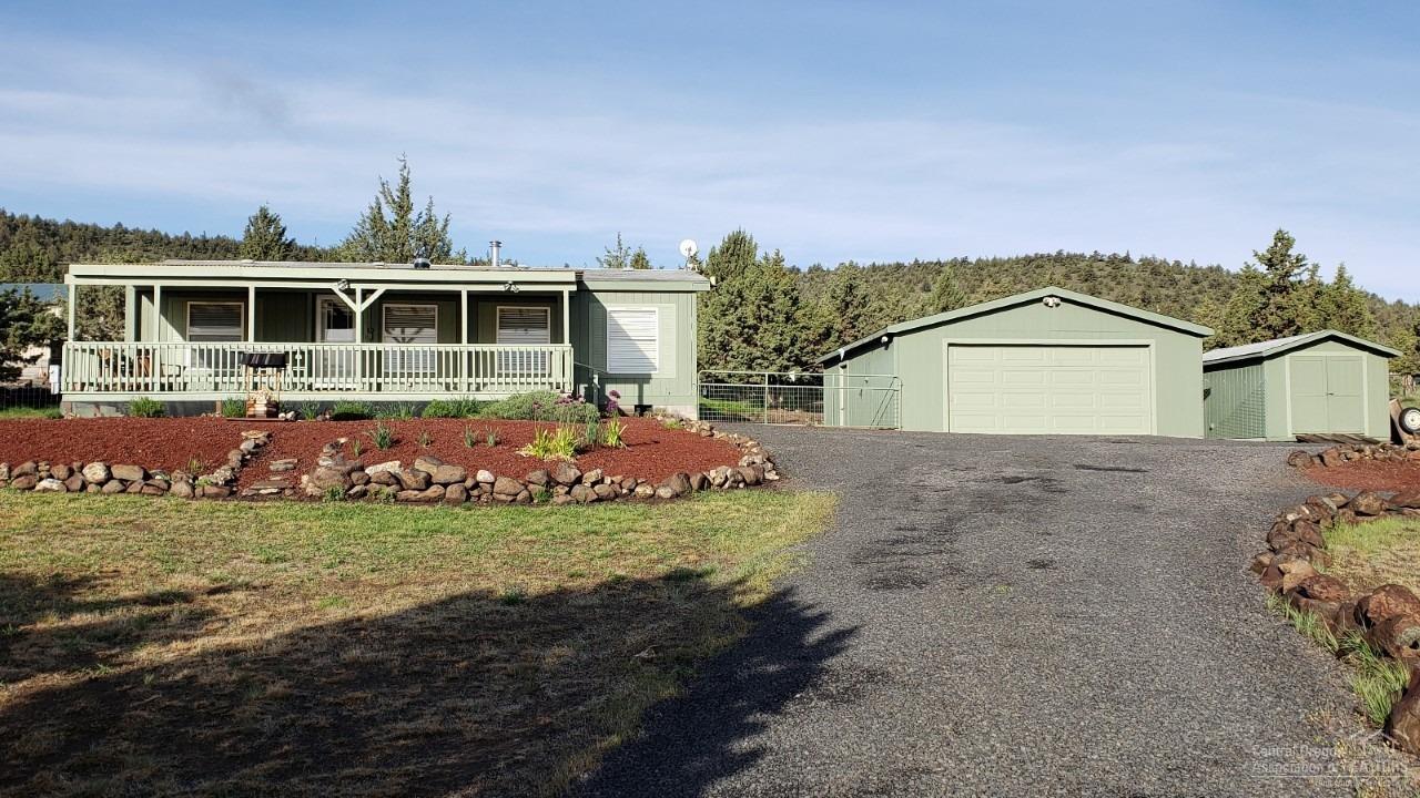 Beautifully maintained 2 bed, 2 bath home on 2.37 acres, just a few minutes south of Prineville. Enjoy amazing views from the deck looking east. Newer laminate flooring and many upgrades. Property slightly sloped to the east with plenty of room for shop or additional outbuildings. RV parking area. This is a fantastic property to call home and enjoy all Central Oregon has to offer including Prineville Reservoir approx 14 miles away. Call for a showing or additional information.