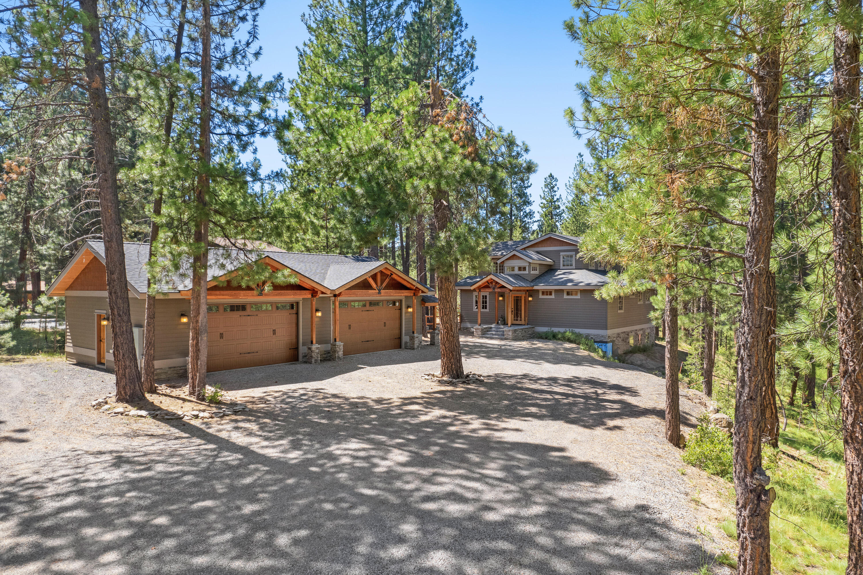 Welcome to your 1.29 acre riverfront retreat on the Spring River. Beautiful unobstructed river views. 90 ft. of river frontage. This 3279 sq. ft. home has been extensively remodeled & updated in 2015. NW lodge style construction features a 2 story wall of windows overlooking river & forest , floor to ceiling rock fireplace, main level view deck. Luxury vinyl plank flooring throughout. The kitchen opens to great room w/vaulted wood ceiling. Custom cabinets, solid surface counters, tile surrounds, & wood trim throughout. The primary suite is on the main level with a private covered patio. Another bedroom on main level looks out on large private courtyard patio for entertaining. Roomy bonus room & 2 bedrooms upstairs. Den or flexroom near entrance. Enjoy the natural landscaping surrounded by towering pines, and firepit gatherings alongside the river. Oversized 4 car garage/shop w/zoned heating. Easy 2.5 miles to everything Sunriver offers. Live your dream today!
