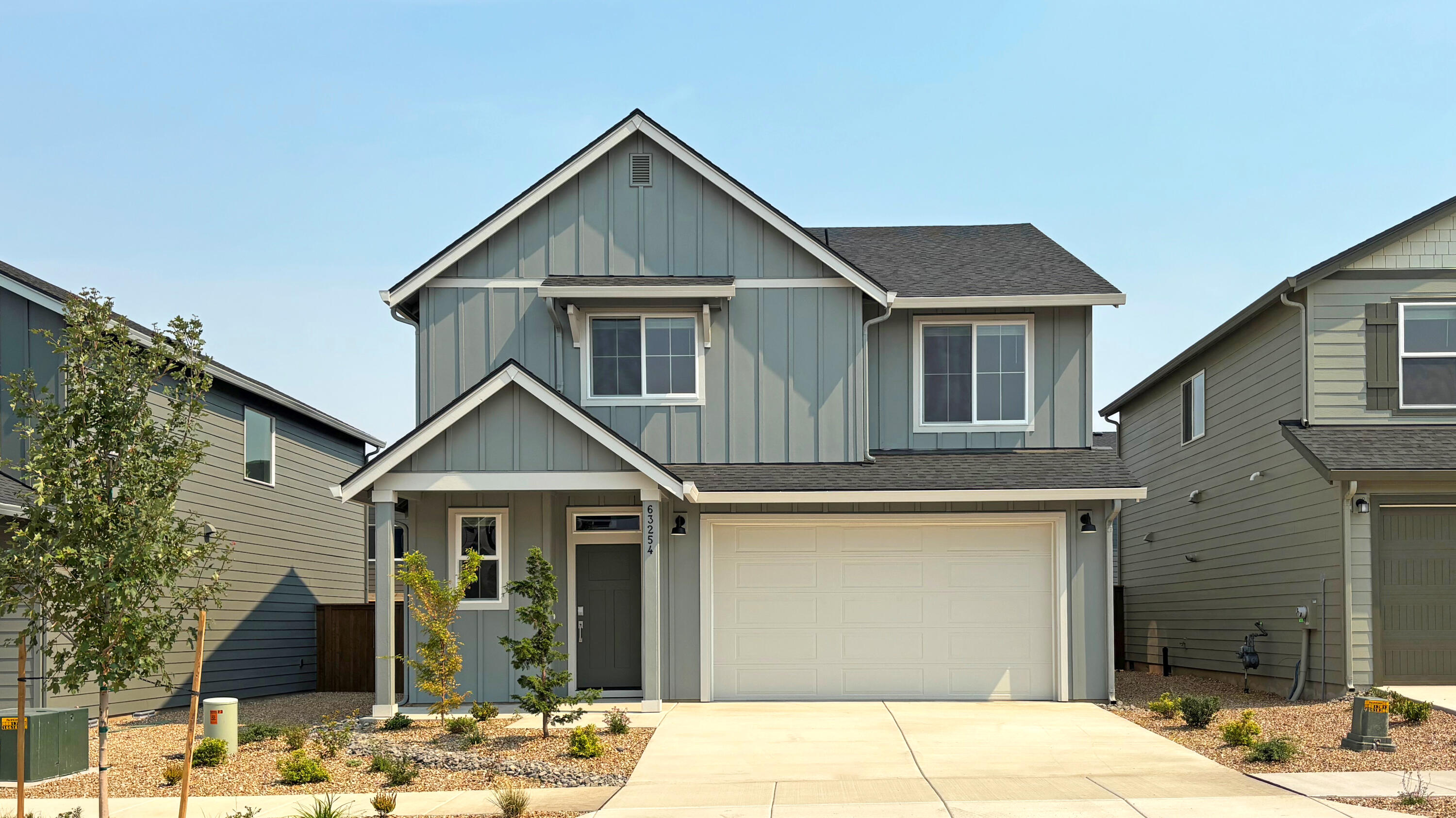 This move-in ready Ashland plan at Acadia Pointe is located in NE Bend with convenient access to shopping, dining, and local parks. The two-story layout offers open-concept living with a great room, dining area, and kitchen that open to a patio, plus a cozy fireplace for added comfort. Upstairs are four bedrooms, including a Jack-and-Jill setup and a spacious primary suite with a connected bath featuring a tub and shower, double vanity, enclosed toilet, and walk-in closet. Interior highlights include quartz countertops, shaker-style cabinets, LVP flooring in the kitchen and entryway, LVT flooring in the baths, two-tone interior paint, an open floorplan, backyard fencing, and xeriscape front landscaping with a drip system. This home also includes central air conditioning, a refrigerator, washer and dryer, and blinds—all at no extra cost! Located on homesite 53. Rendering is artist conception only. Photos are of a similar home, features and finishes will vary.
