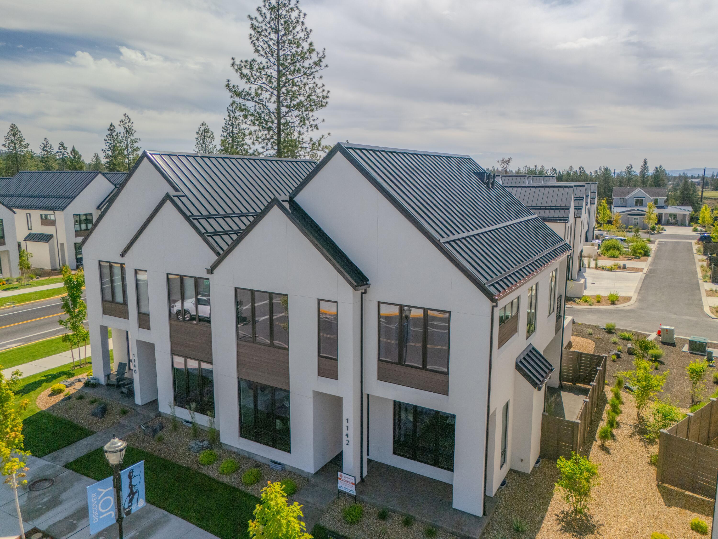 This fabulous Trove Townhome is ideally located directly across the street from Discovery Corner in wonderful Discovery West. COBA Award-winning builder Curtis Homes brings this Scandinavian-inspired modern design to Bend's desirable westside neighborhood. This corner-lot residence is 2354 sqft and features a wonderful open great-room floor plan, 3 bedrooms and 2.5 baths, a gorgeous island kitchen with a stainless-steel appliance package, custom cabinets, a huge walk-in pantry, a spacious upstairs loft, all tastefully finished by the designers at Curtis Homes in a way that compliments the clean Scandinavian esthetic. Located in close proximity to future Discovery Corner Plaza, a mix of storefronts, gathering spaces, and venue for neighborhood events. Easy accessibility to popular walking and biking trails. Trove offers carefree active living in this outstanding Discovery West location