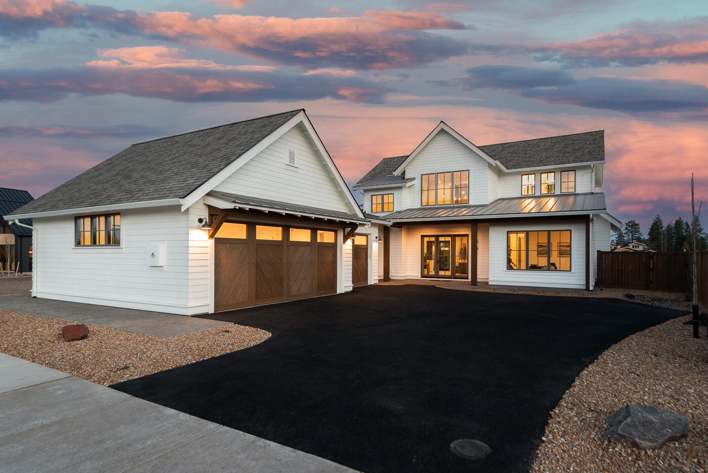 Nestled in the heart of Discovery West, this stunning American Farmhouse by Structure Development NW seamlessly blends timeless elegance with modern convenience. Versatile open floor plan designed to accommodate both family living and entertaining. Spacious foyer flows into a sunlit great room featuring high ceilings, exposed beams, gas fireplace, and large windows. Kitchen boasts high-end appliances, custom cabinetry, large center island, and walk-in pantry. Dining area provides seamless access to covered patio for outdoor living. Main level primary suite offers an ensuite bathroom with soaking tub, a walk-in tile shower, and walk-in closet. Two bedrooms, full bathroom and a bonus room on upper level. Additional features include a home office on the main level, a mudroom with built-in storage and three-car garage. Located in the vibrant and family-friendly Discovery West, in close proximity to parks, trails, schools, and all the amenities that make Bend a wonderful place to call home