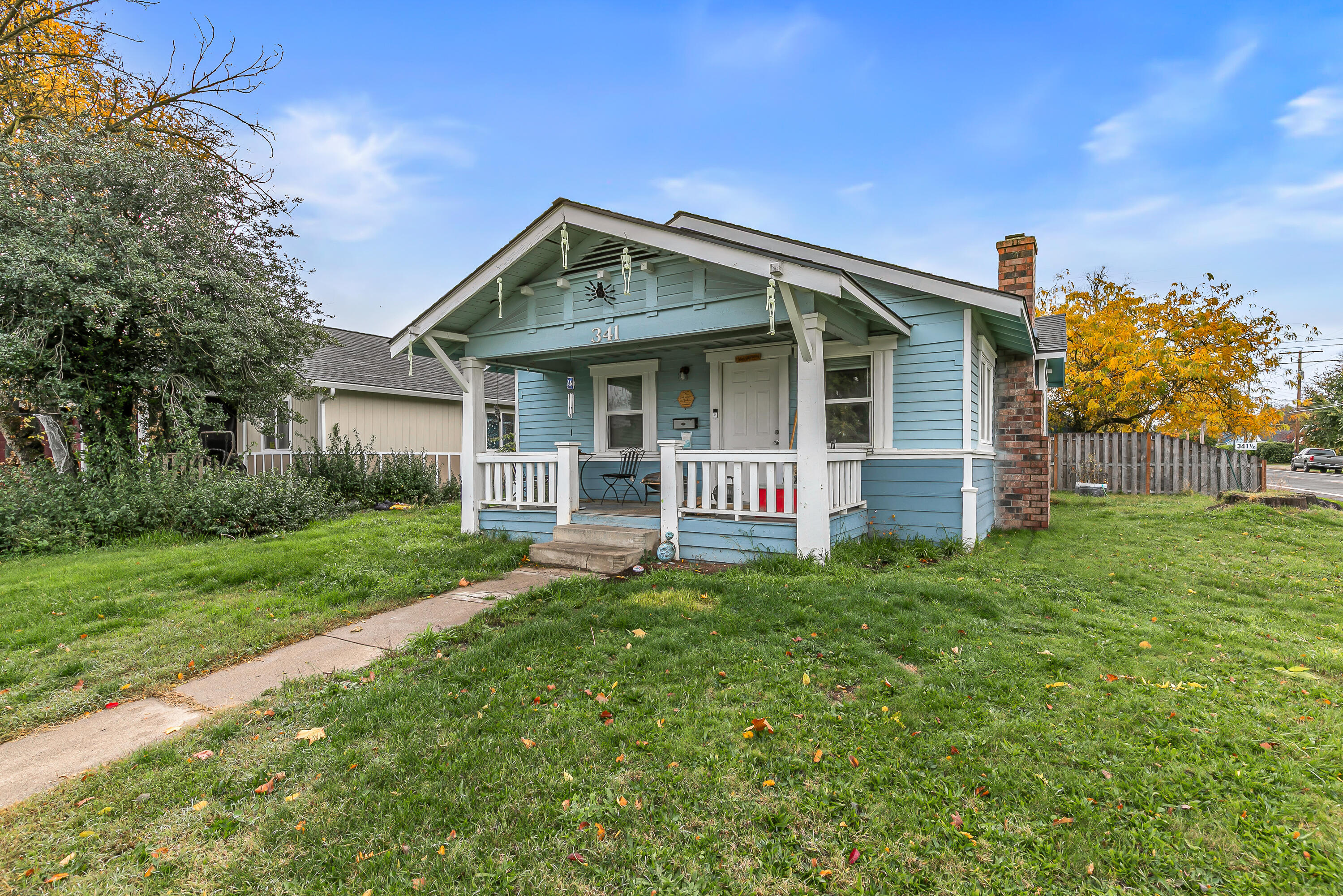 Investor alert! Beautiful home with a detached ADU—both homes rented with excellent long-term tenants bringing in instant income. The main home features 2 bedrooms, 1 bath, charming arched doorways, a welcoming front porch, open floor plan, a bright kitchen with breakfast bar, and a large laundry room with cabinetry for extra storage. The detached studio ADU offers a mini-split system for heating and cooling, full kitchen, laundry, full bath and alley access parking. Newer roof, updated vinyl windows and new sidewalks add extra value. The garage with alley access is being used as two separate storage spaces for tenants. Both homes are in good condition and well maintained. Tenants wish to stay, providing instant, stable cash flow for the next owner. Strong rental history and low-maintenance setup make this a perfect turnkey investment opportunity. 24-hour notice required for showings—please be respectful of tenants.