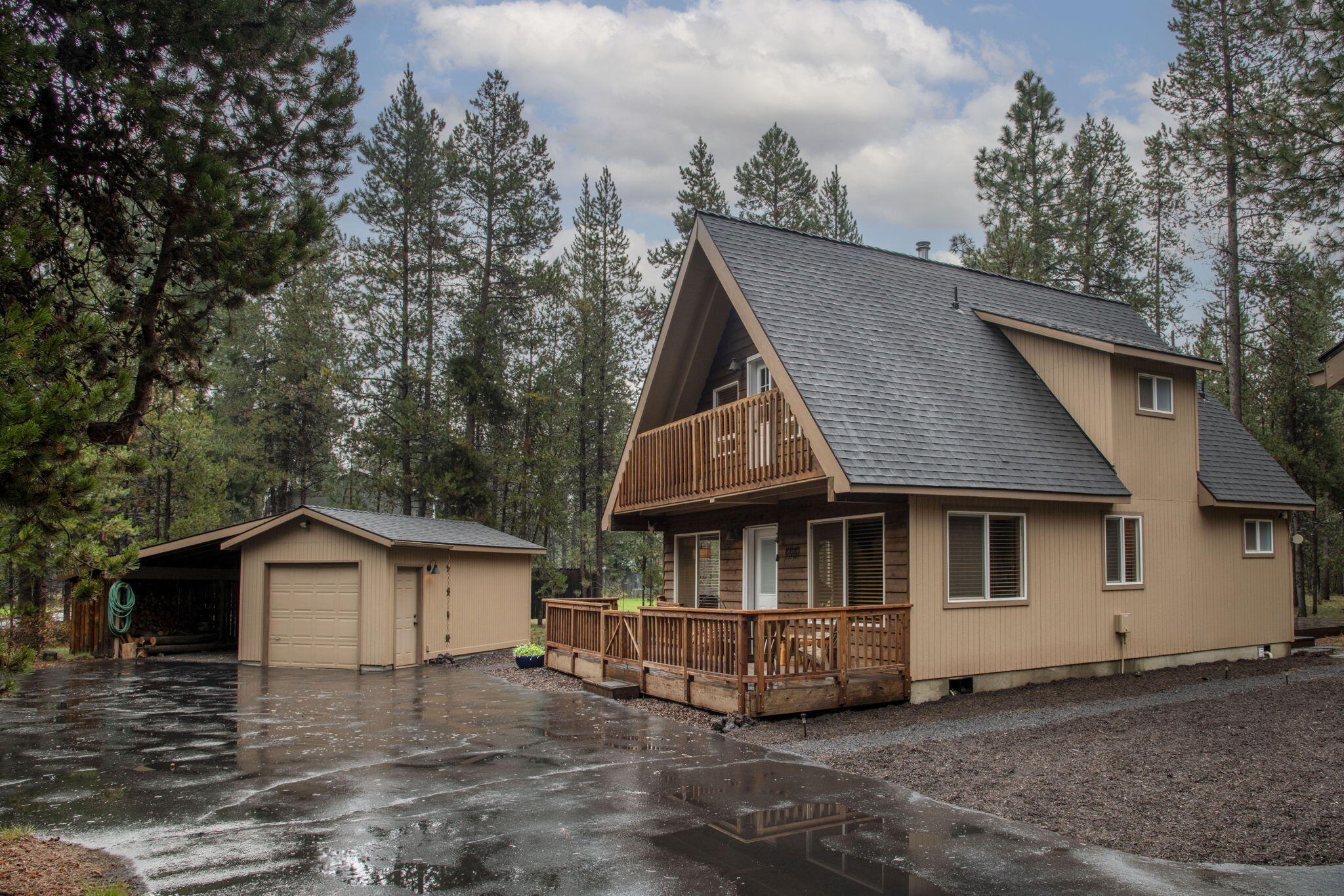 Discover a charming winter and summer retreat just 5 minutes from Sunriver and a short distance to the Deschutes River. Set on over an acre of forested land, this enchanting property boasts a nicely updated three-bedroom, two-bathroom A-frame house with an open floor plan and a wonderful cabin vibe. One bedroom and bath on the main level. Two bedrooms with vaulted ceilings upstairs- one has a covered balcony and a bath in between both. Additional sleeping, living, workout space in the bunkhouse and deck attached to an oversized two-car garage, plus a separate one-car garage and carport. Enjoy the convenience of a spacious 28 by 30-foot pole barn with power. Plenty of room for all of your toys or workshop projects! The area has a designated boat ramp for homeowners in Deschutes River Recreation Homesites. A true forest haven!