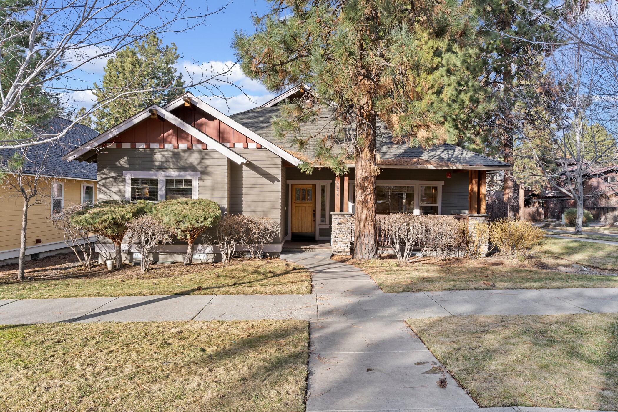 Cozy up to this charming Craftsman style, single level home on a fully landscaped corner lot in Northwest Crossing. This 1,818 sf ,3 bedroom, 2 full bath floor plan offers stain grade trim, hardwood floors in great room, eating area, kitchen and hallway, slate and ceramic tile floors, stainless appliances, central air, washer & dryer, refrigerator, pantry, vaulted ceiling in great room, gas fireplace with built in book shelves, pull down storage in 2-car garage, covered porch, side yard with privacy fence,  concrete patio  pavers, and cultured stone columns. Ideal location, across from High Lakes Elementary School, close to The Grove, shopping, trails, and restaurants. Well maintained and ready for the next owner.