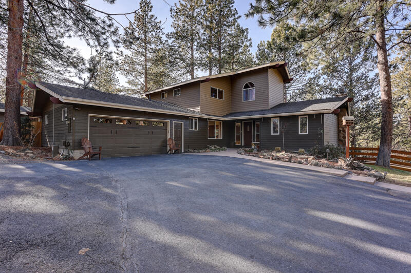 Looking for vintage charm in Woodside Ranch? This property is situated on 2.5 acres and includes two separately standing homes! The main house has 2,751 square feet of beautifully upgraded living space. You will find an open floor plan and some mid-century features such as a rock fireplace and sloped ceilings. The fully upgraded kitchen hosts concrete counters, island, and new appliances. There are four bedrooms, including the primary bedroom located on the main floor, 3.5 bathrooms, family room, space for home office or home gym and a two-car attached garage. And that is only the main house! This fantastic property also features a 952 square feet guest house! Here you will find a single level, one bedroom, one bath home with another full kitchen, one car garage and attached private deck. Outside the landscaping is mature and extensive, allowing for as much enjoyment outside as can be found on the inside of this home. This property is a treasure and will not be missed!