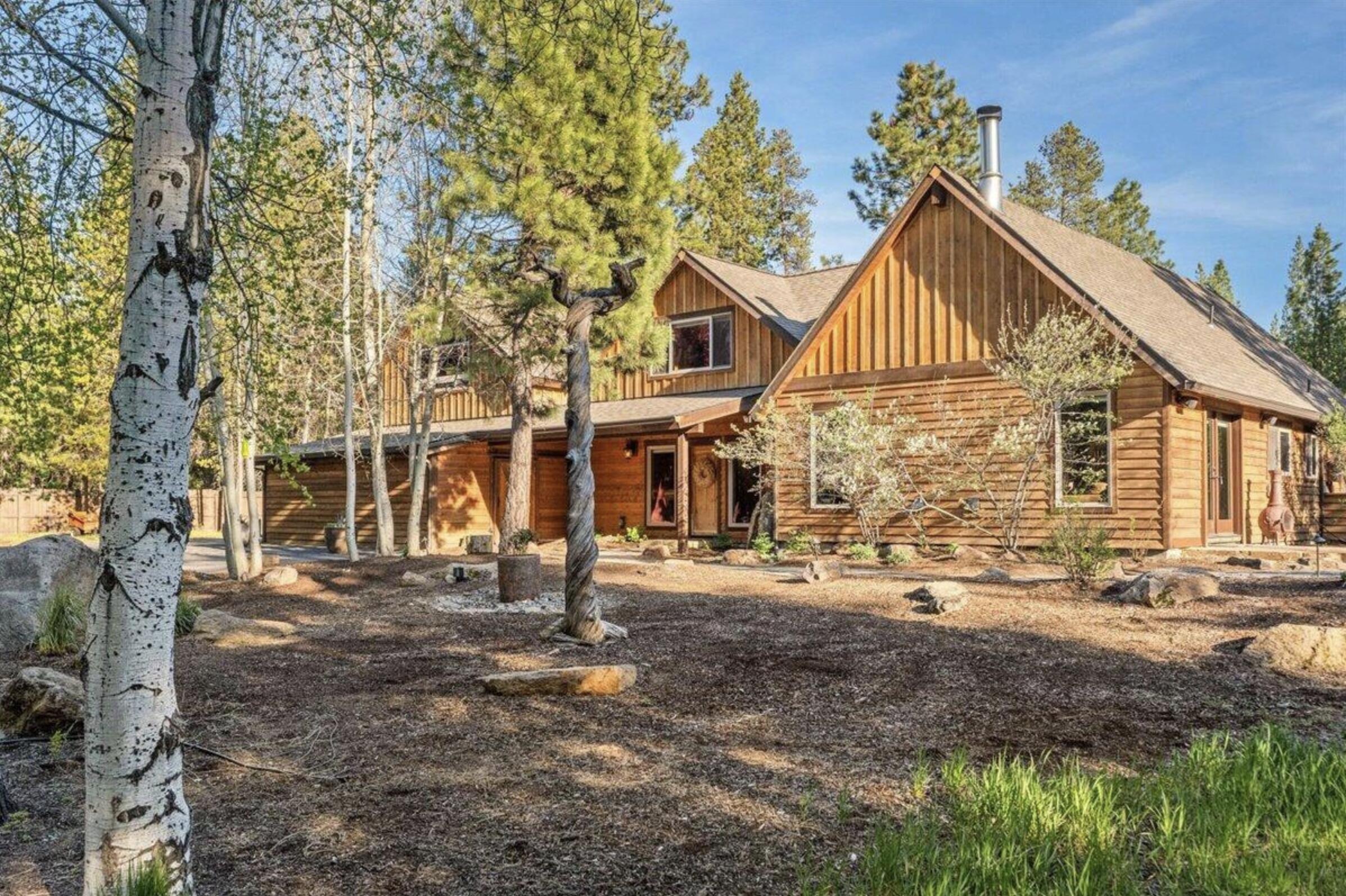 Seller offering10 k towards buyers closing costs & or prepaids/rate buy down w/accepted offer. Truly remarkable, custom-built rustic home! The extraordinary property offers a secluded & peaceful ambiance from the moment you pass through the electric iron gates & onto the paved private drive. Located on 4.69 acres that backs to National Forest and exudes privacy! Upon approaching the entrance, a charming rock fountain at the front door sets the tone for a warm welcome. You will be greeted by a stunning and spacious chef's kitchen that is as beautiful as it is functional with a brand-new Wolf Stove installed in 2025. Adorning the kitchen are exquisite burlwood countertops w/island, custom cabinetry, elegant pendant lights & a beautiful copper sink. Adjacent to the kitchen, a unique wine cellar awaits! Step down into the sunken Livingroom/w a huge rock fireplace for those cool mornings & evenings! The expansive 3-bedroom, 2-bathroom, 3,336 square foot home is filled with special touches