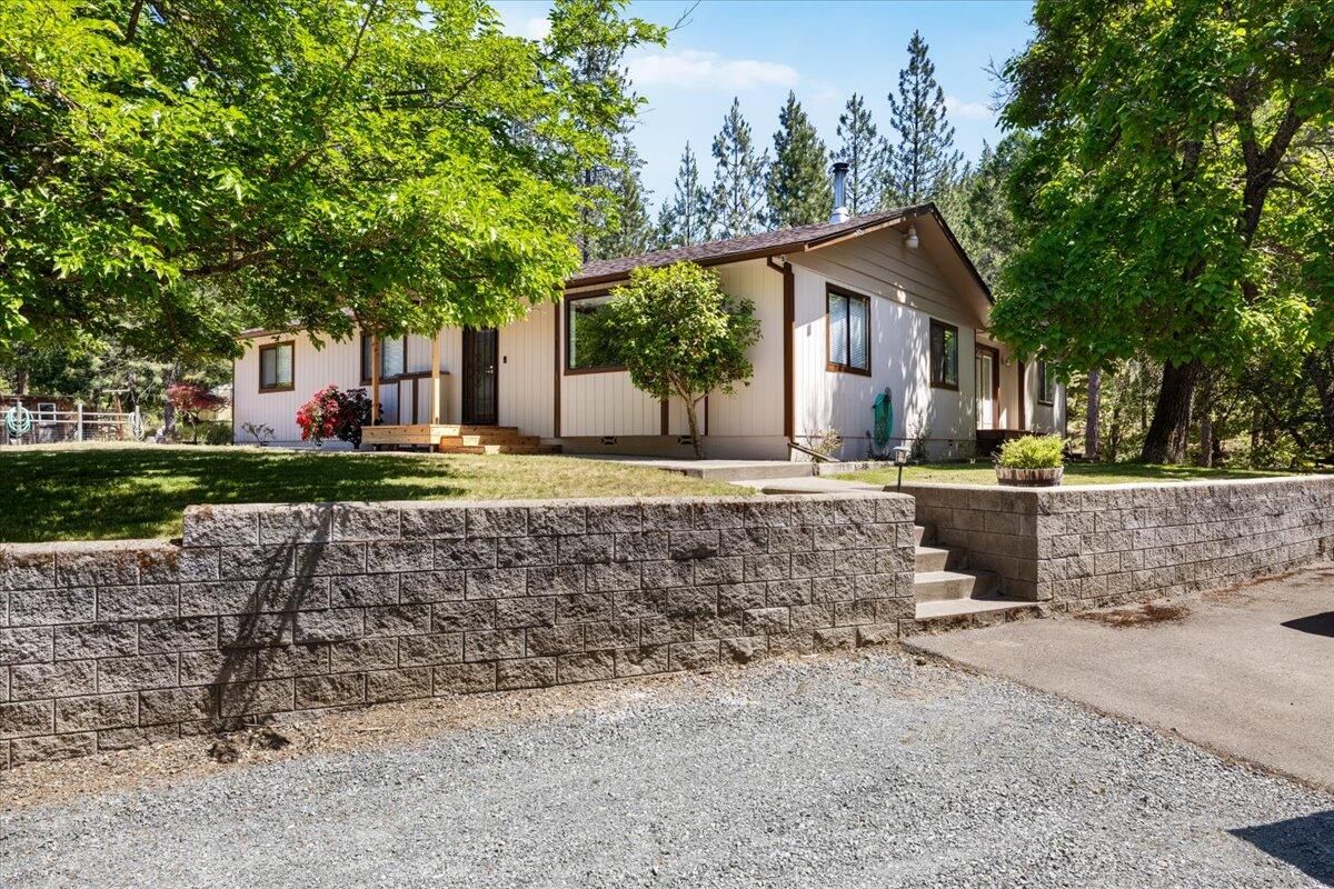 Nestled on a generous 5-acre lot you will find a spacious 4-bedroom, 3-bathroom home, with a bonus office, spanning 2,563 square feet. This home has ample room for comfortable living and outdoor spaces perfect for entertaining, and don't miss the 2,376 square foot detached shop! This location provides space to breathe, cultivate, and create. Envision a flourishing garden, trails for exploring, or simply enjoying the tranquility of your own natural sanctuary. The RR-5 zoning ensures continued privacy and a rural feel. Bolt Mountain Road offers a coveted blend of seclusion and accessibility. Bolt Mountain road is far out enough to feel away from it all, yet close enough to the vibrant heart of Grants Pass to enjoy all its amenities.
