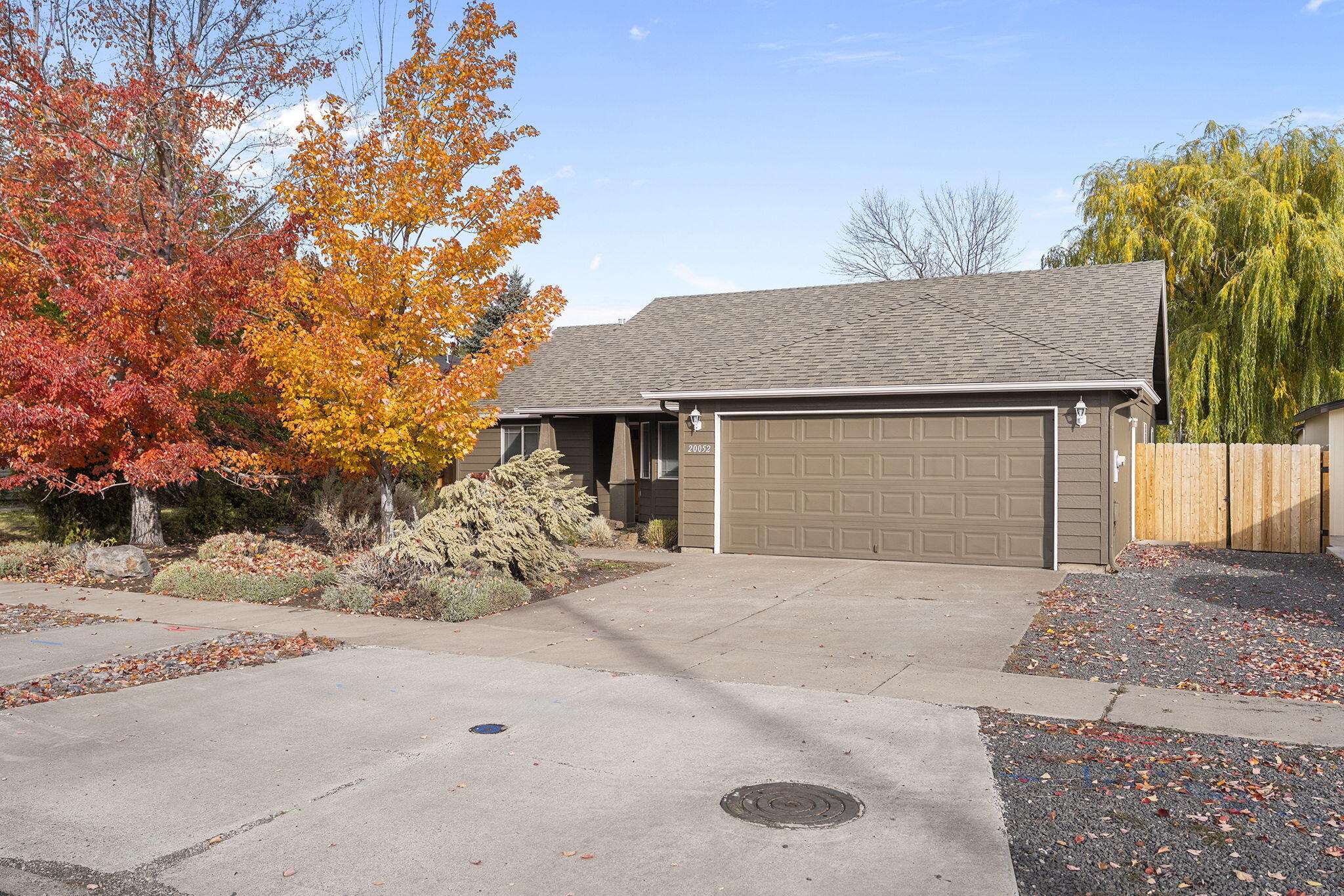 Welcome home to this charming single-level, 3-bedroom, 2-bath home located less than 2 miles from the Old Mill and under 1 mile from the Deschutes River Trail. Enjoy Bend's best outdoor lifestyle with the convenience of town nearby. Thoughtful updates include a new hot tub, exterior paint, stainless steel appliances, HVAC system, fencing, and updated flooring in the primary bath. Offering a $4,000 credit toward new flooring so you can add your personal touch. Features include vaulted ceilings, a cozy gas fireplace, low-maintenance front landscaping, mature trees, and side RV parking with a 2-car garage. The spacious primary suite offers an ensuite bath, and the home is sold fully furnished—ready for you to move right in and start living the Bend life. Call for your private showing today!