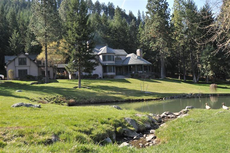 Imagine, if you will, an amazing French country estate nestled in the Oregon Mountains, very private yet centrally located with easy access to Jacksonville, Rogue Valley International Airport and Ashland. The home is elegant and yet inviting! There are two master suites, gourmet kitchen, custom cabinetry, Italian tile and handcrafted wood. Main master suite is complete with sitting area and marble & tile in the bathroom. Very spacious office, open kitchen into the great room and three fireplaces make it an excellent floor plan. Out every window is something wonderful: waterfall, ponds, pastures, mountains and wildlife. Horse facility is great too with an 8 stall barn, large feed and tack rooms, automatic waterers, full bathroom, hot-cold wash area, turnouts, large arena, fenced pastures and miles of trails right from the property. A bonus to the property is a guest suite above the 3 car garage, gated entry for privacy, and an additional home site approved on its own tax lot.