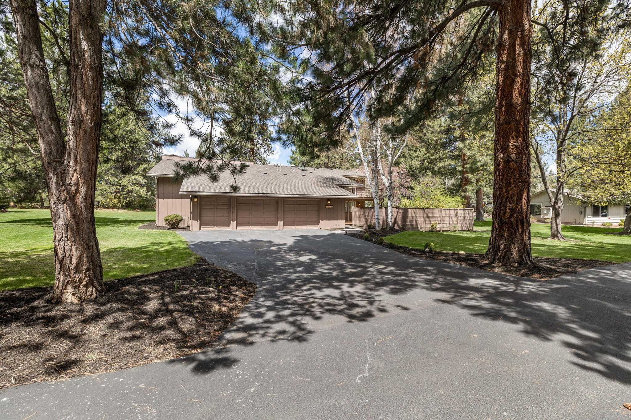 Rare find of a home under $300 a sqft in Bend! Lovely 4007 sqft home in Timber Ridge sits on a spacious .39 acres. This home is one of the few that has a fenced side yard. Tons of natural light to complement this entire home which includes a built-in bar area, large primary suite, walk in closet, and an updated primary bathroom. A large kitchen opens to the family room with a gas fireplace. Separate office area, formal dining, and space for entertaining. This home is one of the largest in the neighborhood and has a huge backyard with an area pre-wired for a hot tub. HOA covers landscape and snow removal.