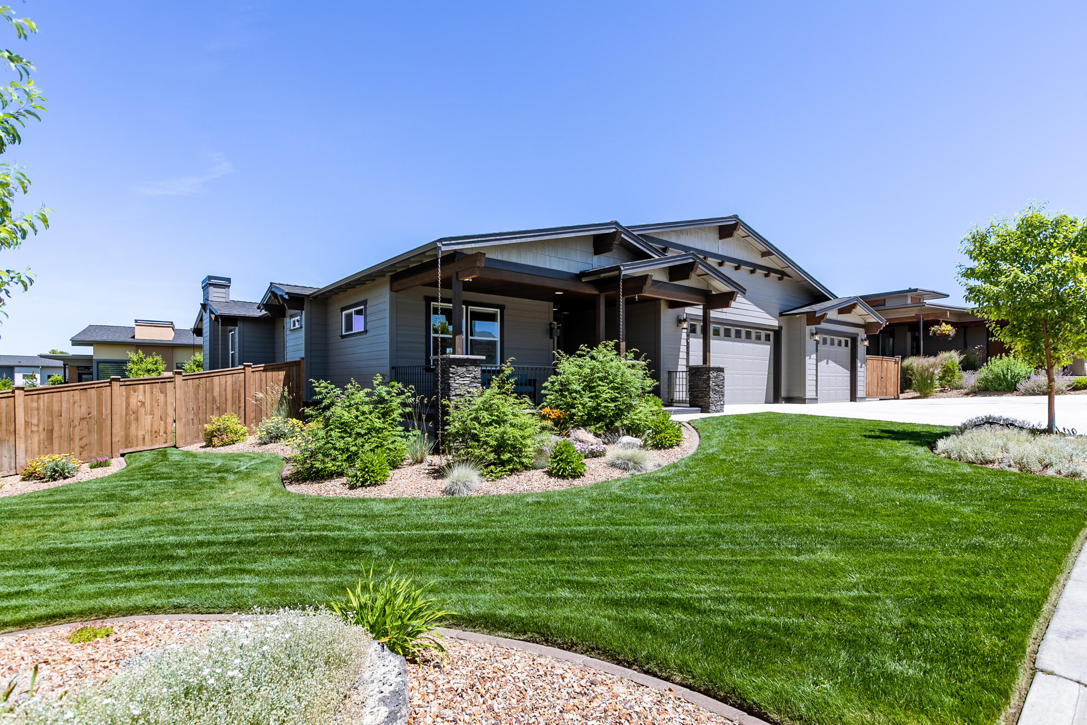 First time on the market! You will enjoy everything about this one level open floor plan home in Red Tail Ridge.  3 Bedroom 2 Bath home features extensive laminate flooring in high traffic areas, Gorgeous custom kitchen with Slab Quartz countertops, Stainless Steel suite of Kitchen Aide Appliances, Custom Tile back splash with under counter lighting.  18 X 13 Master bedroom with walk in closet and step in custom tile shower. Surround sound in great room, Master and rear patio areas. Barn Door accents the entry to the guest suite area of the floor plan.   30 X 37 Attached Three car garage.  14 X 28 Concrete RV parking.
Inviting Covered front porch with raised pavers, and large back raised paver  patio off the rear of the home. Fenced and beautifully landscaped. Peek a boo mountain views.