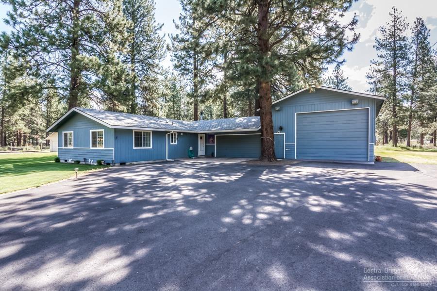 Shop and single story home priced under $400,000 in SW Bend! The 1,075 (25 x 43) square foot shop has 12' tall x 16' wide garage door to accommodate RV parking. The insulated shop has 220 power, work benches, concrete floor, garage door opener, (2) wall heaters, and woodstove. Since purchasing the property in 2013, the seller has had installed all new double pane vinyl windows, new roof in 2015, new pellet stove, new electric range and refrigerator, new kitchen faucet, new cadet heaters in bedrooms, new back deck, and paved the driveway. 10' x 12' green house has water.