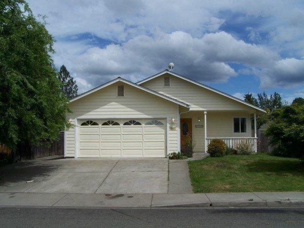 Single level 3 bedroom, 2 bath home in quiet District 7 neighborhood close to hospital, shopping and elementary school. Home features front and back covered porches, vaulted living room with plant shelves and tile entry. Nice size fenced backyard with shed or shop and RV parking.