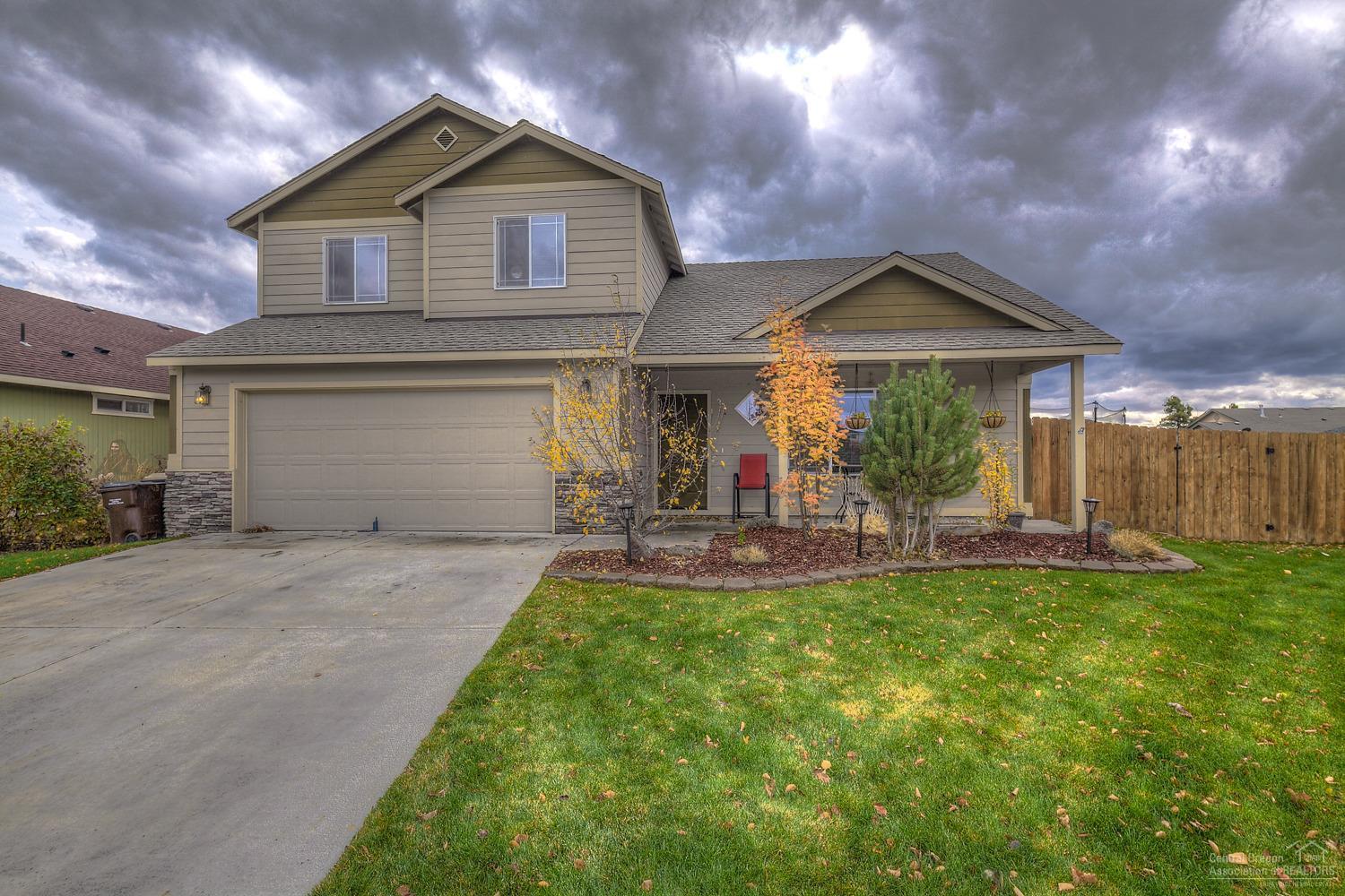 Enjoy entertaining in this expansive NE home w/covered front porch. Two living areas w/a central dining area, spacious kitchen w/corner pantry & beverage station. Front living room features a corner gas fireplace w/slate surround. Upstairs you'll find a Master Suite, den/office and 2 additional bedrooms. Lg back yard w/new landscaping, concrete patio, auto sprinklers & fully fenced for family & pets. Potential to park RV as this is a corner lot. Dbl car garage for ample storage. Call today for details!