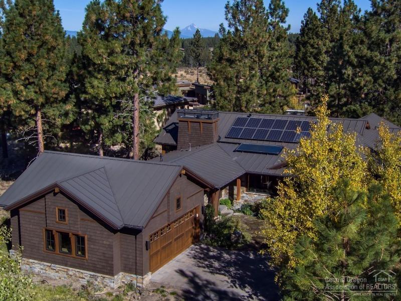 Imagine living in perfect harmony w/nature! Stunning custom home blt by Greg Vendrome in exclusive Shevlin Commons w/Cascade Mtn views. Open great room plan w/concrete floors & radiant heat. PV Solar. Kitchen designed by Kirsti Wolf is a chef's dream. Sub Zero, Wolf appliances, honed granite counters w/onyx back splash. Copper FP, beautiful blt-ins & a pizza oven. Gorgeous master w/wood barrel ceiling. West side, close to Shevlin Park, trails, & downtown. Wonderful landscaping w/outdoor FP & water feature.