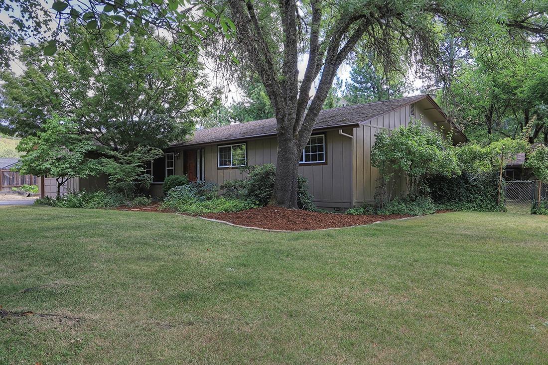 This property has been well maintained by the same owner for 40 years and it shows. Beautiful setting in a wonderful neighborhood close to town. This is the closest address to Dollar mountain hiking trail. The home features 3 bedrooms, 2 baths all on one level with a large feeling 1508 sq/ft. with a large family room including a gas fireplace. The mature landscaping offers a very peaceful setting along with the water feature in the large backyard. There is a cute playhouse in the backyard as well that matches the house. There is so much to see and enjoy with this property.