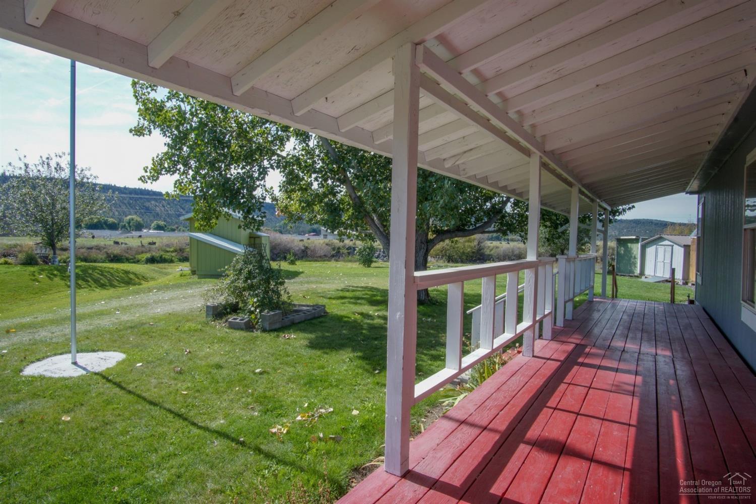 River views from the covered front deck of this well maintained home on almost half an acre in a<br>cul-de-sac. This 3 bedroom home has a split floor plan with nice sized master suite, each bedroom has a walk-in closet and newer carpets throughout the home. There are several storage buildings for all of your treasures.