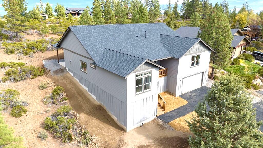 This stunning single-story, brand new home perched atop Pumice Butte offers an acre of space and breathtaking views; and is now move-in ready! It is located only mins from Old Mill District and downtown Bend.  There are just 2 homes on the 23 acres behind the property, creating amazing privacy. This home has 3 beds/2 baths, plus an office, lg flex room, oversized garage and detached workshop.  There is plenty of room for an RV, toys or another shop. Inside, you will find a spacious, open layout with a vaulted great room and top-notch finishes, such as quartz counters, hardwood floors, tiled shower & bath floors, stainless appliances and much more. A rock fireplace and hearth infuse the space with warmth and character. A large covered back patio is perfect for entertaining, and the front deck offers incredible Paulina views, creating a serene spot to relax and enjoy nature & local wildlife.  If you are looking for a beautiful new home, space and privacy, come check out this home!