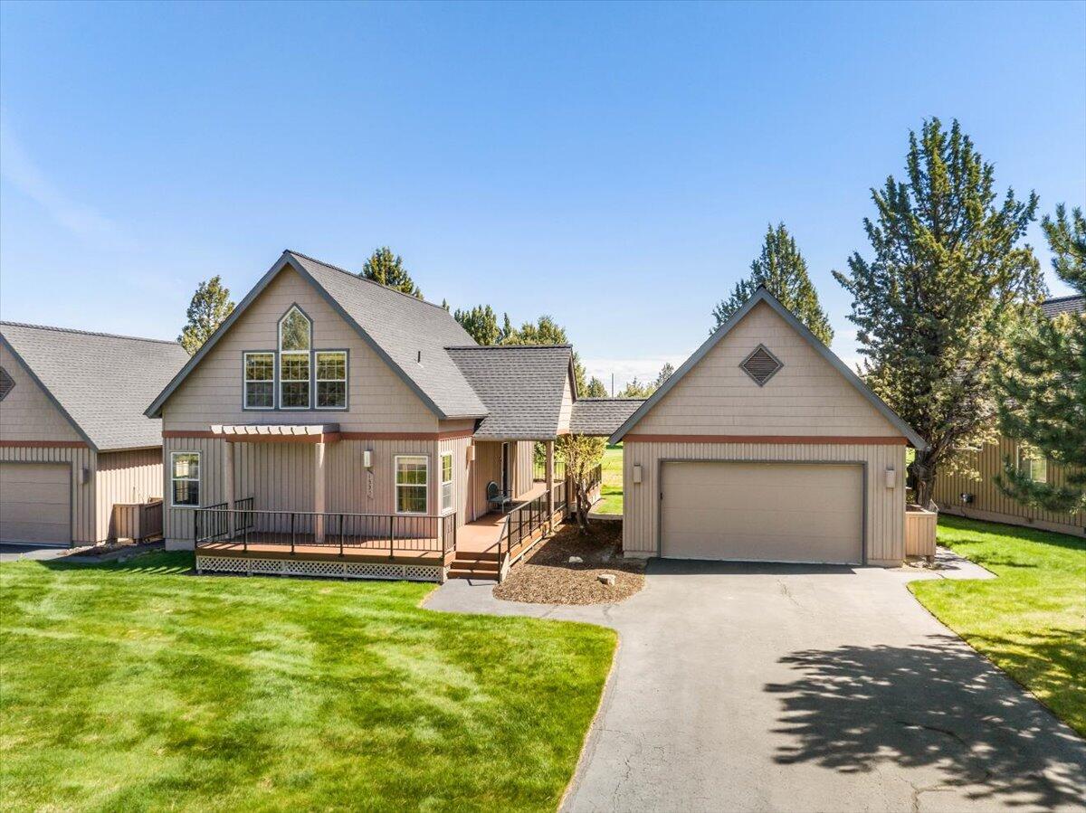 Fabulous location on the 10th fairway of The Ridge Course in Eagle Crest Resort! This turnkey chalet has an open-concept floor plan featuring a vaulted great room with a gas fireplace, a warm pine ceiling and paneling, log agents, solid core doors, and wood wrapped windows and trim. The spacious dining room is adjacent to the galley style kitchen with breakfast bar and pantry. Two guest rooms, a full bath and laundry center complete the main level. Upstairs you will find a spacious loft with beautiful views and the primary suite with a built-in dresser, dual-sink vanity, and a walk-in shower. Expansive wrap-around front and rear deck for enjoying time outside. The double car garage makes this a perfect second home, vacation rental, or a primary residence! The extensive list of upgrades in 2018 include: Refrigerator, range, microwave, dishwasher, washer, dryer, garage door, flooring in kitchen, bath, and a new toilet on lower level. Enjoy all Eagle Crest Amenities!