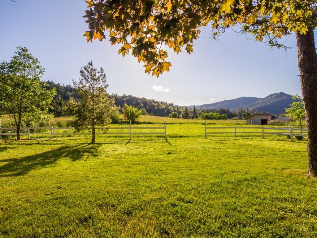 Fabulous views enhance this immaculate one-story home on 1.46 level irrigated acres in desirable Jerome Prairie. You'll want to call this one home from the moment you drive up! The floor plan features a covered front porch, bright open living room and dining area with bay window and glass doors onto huge back deck ready for entertaining. Kitchen has solid red oak cabinetry, 2 pantries and 2 skylights. The 3 bedrooms have roomy closets and ceiling fans; one has access to back deck. Two bathrooms and a laundry room complete the interior. Move-in ready with double pane windows, 2 water heaters, new roof in 2015, heat and air conditioning, good well, district irrigation, attached garage, RV parking, 12x20' barn with metal roof; 12x12' storage shed, fruit trees, fenced pasture, mature landscaping and convenient location close to town! Be ready to fall in love!