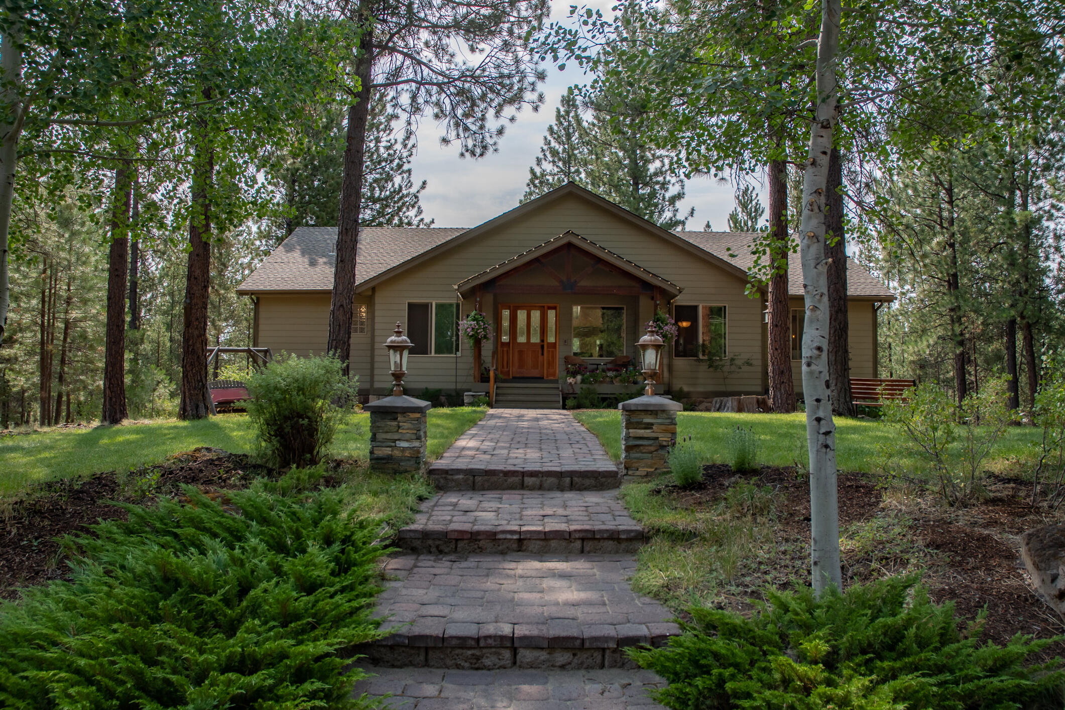 Amazing family home on a private, dead-end street with owner-only Spring River access - surrounded by beautiful National Forest lands. NO HOA fees! Would make a perfect VRBO investment - 5 min from Sunriver Resort, 15 minutes from downtown Bend, and 15 min from Mt. Bachelor Ski Area. All main-level living with great separation between master suite and guest bedrooms. 4th BR OR Office on main level as well! Kitchen upgrades & newly-remodeled master bath w/heated floors. Remodeled powder bath too. 864 sq ft shop with office/studio. RV parking with 220 amp service and water. Trails just outside the back yard to enter National Forest for hiking or running the pups! Huge bonus/media/party room in daylight basement has full-bath and great bar area as well as a Murphy Bed. Sit on the front porch, back deck or lower patio! RV parking income potential. Enjoy great schools, golf nearby, proximity to high lakes and everything that Central Oregon has to offer. Pilots! - S21 is just 5 minute drive!
