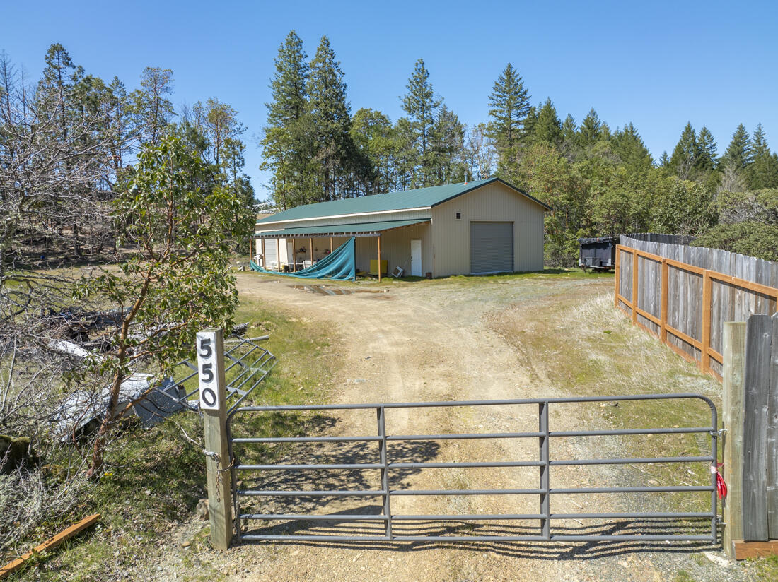 Motivated Seller! Secluded mountain retreat spanning 15+ acres across 3 parcels, offering unparalleled privacy and breathtaking views! Featuring an impressive 30'x80' shop ideally suited for a home-based business, the property is serviced by a private well (8 GPM per Seller) and generator power, with a transformer conveniently located at the property line. The large developed flat presents an excellent opportunity for a future homesite. Step inside the shop to discover a fully equipped workspace with ceiling-mount industrial-grade propane heaters and split AC units for optimal climate control. The bathroom onsite is complete with a toilet, sink, and shower featuring on-demand hot water. The Seller has previously inquired with Pac Power to establish public utility to the property. 2500-gallon water tanks and 40' spray-foam insulated cargo containers sold separately. Exceptional property where tranquility meets functionality. Experience the ultimate in mountain living. Don't miss this!