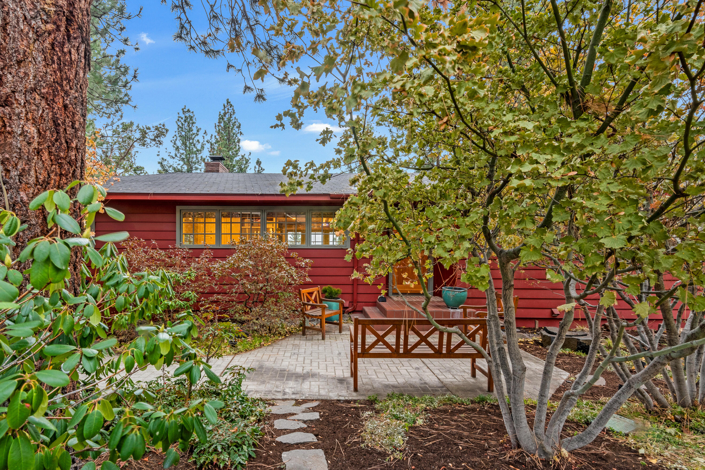 Desirable West Hills home situated among beautiful mature landscaping on a large lot with Southern views. Close-in location allows for walkable access via neighborhood trail to Newport Market area, restaurants, and downtown. Featuring wood floors, Caesarstone counters, open kitchen/living floor plan with bright windows to a large deck with a view. Large primary suite with dual sinks, soapstone counter, in-floor heat, and double-headed shower. Includes hot tub located off the primary bedroom. Laundry chute from main floor to the laundry room. Energy efficient gas furnace and air conditioning with WiFi-enabled controls. Enoy Hillside Park which includes a dog park, hiking trails, playground, and open grassy areas. Quiet, peaceful neighborhood with the convenience of living in town.