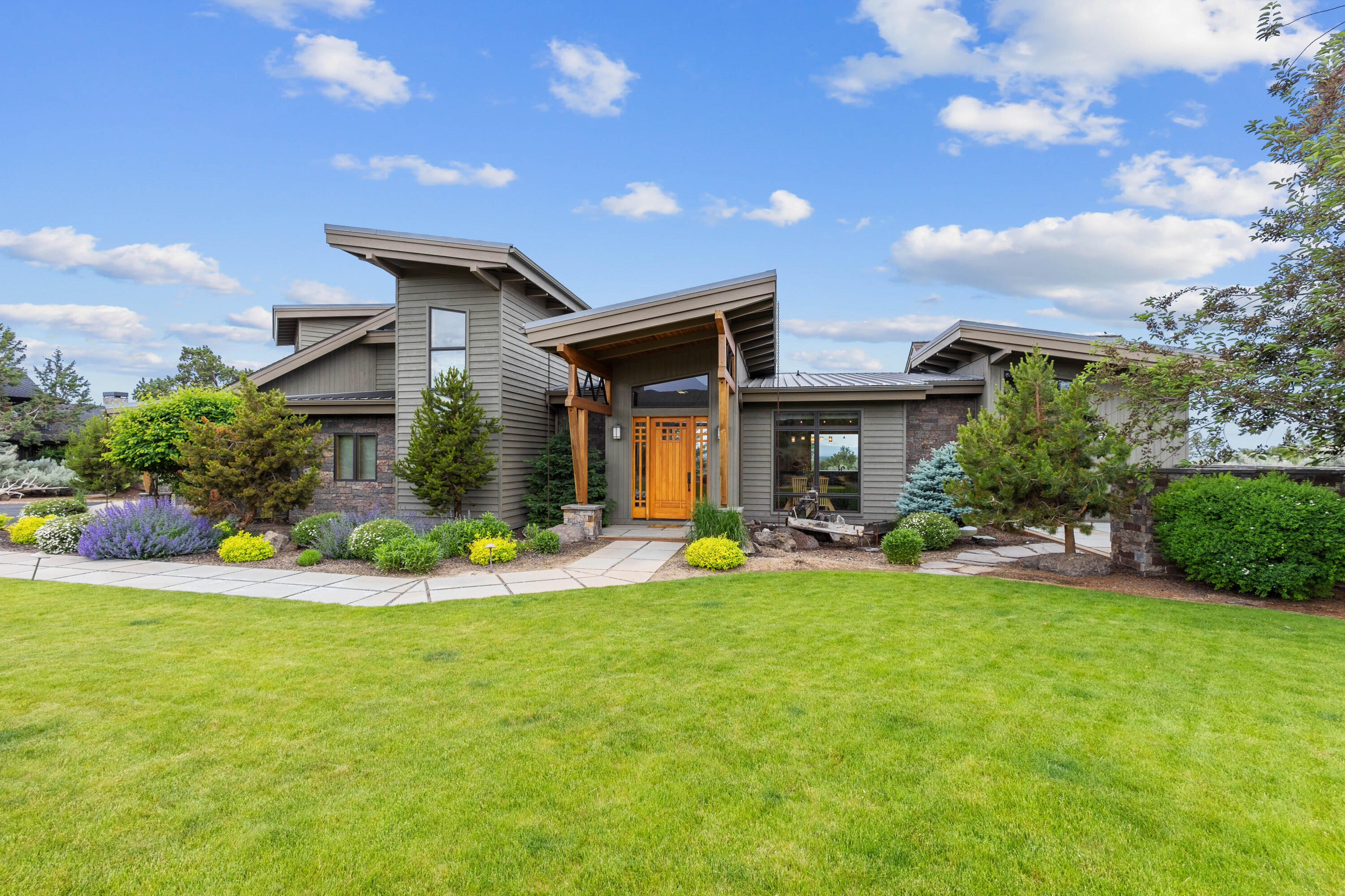 Experience the pinnacle of luxury in this stunning contemporary home at Brasada Ranch! Enjoy breathtaking Cascade Mountain views from your expansive outdoor oasis,
featuring a gourmet kitchen, cozy fire pit, refreshing shower, and serene water features. This Control 4 Smart Home is equipped with sound system, automatic shades, and
newly finished hardwood and tile floors beneath soaring beamed ceilings. Indulge in the elegance of quartz countertops and high-end appliances, including a Wolf range
and new KitchenAid refrigerator. With a spacious utility room and a garage boasting ample cabinets and epoxy floors, style meets functionality. Plus, dive into the
incredible amenities of Brasada Ranch—an 18-hole golf course, restaurant, pool, member club room, equestrian center, and more await you. Don't miss your chance to
embrace the ultimate luxury lifestyle!