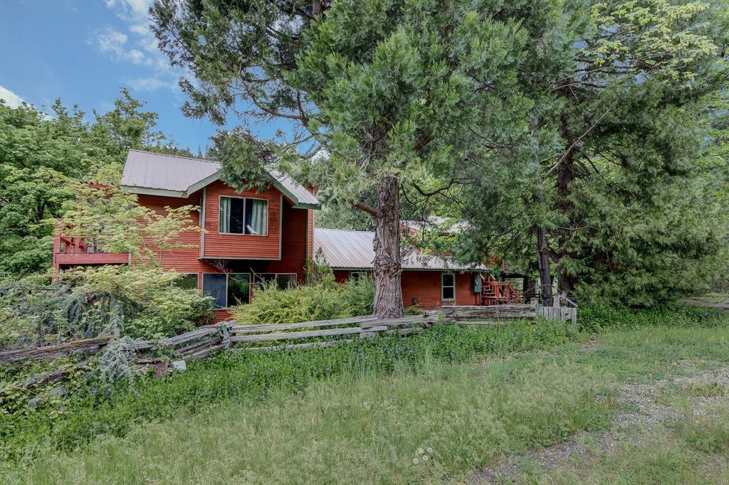 A quaint country bridge leads you to the Oregon dream. Abundant in natural resources in a storybook setting. Beautiful Deer Creek runs through this one of a kind property featuring sunny pastures, a year round spring, and a rustic barn on 160 acres near Lake Creek. Ideal for a farm or ranch with EFU/FC zoned land and and you'll enjoy the privacy with acres of BLM land bordering the property's backyard. Flat open pasture will lead you to the top of the hillside where you will enjoy breathtaking views and timber-rich forest combined with hidden open meadows. The 2770 sqft home's floor plan is suited for friends, family & possible multi-family set up with 4 bedrooms and 4 bathrooms & 2 kitchens. The main kitchen has plenty of storage & opens to the living room. Living room is adorned with a cozy wood stove & an abundance of natural light. Guests on the upper level have their very own kitchen. The view of the landscaping from the covered porch is beautiful & timeless.