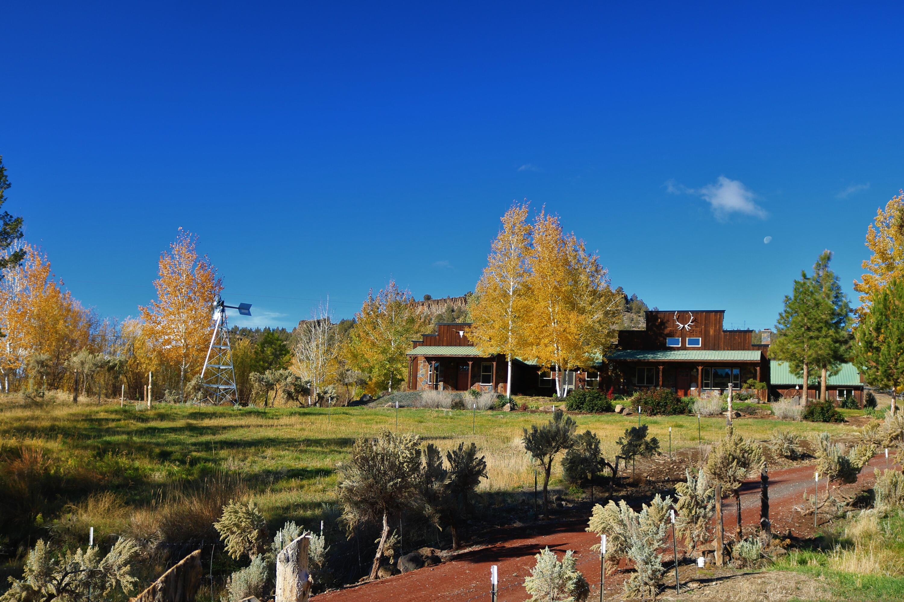Are you ready to feel like you have stepped back into simpler times? Then this is just the place for you. It will be easy to settle in to this quiet, secluded, safe place & enjoy the country western lifestyle. Located just minutes from Prineville, Redmond, & Bend, enjoy premium privacy & all the amenities that Central Oregon has to offer, without having to sacrifice a long drive to modern conveniences. This 105.77± acre ranch includes 29.3± acres of irrigation, primarily from a center pivot, which makes it the perfect setup for a small herd of cattle, horses, or other livestock. A uniquely designed 2,076± square foot, western style home, offers 3 bedrooms, 2 bathrooms, family room, living room, large kitchen, & amazing courtyard to make entertaining & outside dining something to look forward to everyday. This is the perfect balance of old west with high-end amenities you would expect in a custom home. Featuring solid fir doors, knotty alder trim & cabinets, slate & hardwood floors.